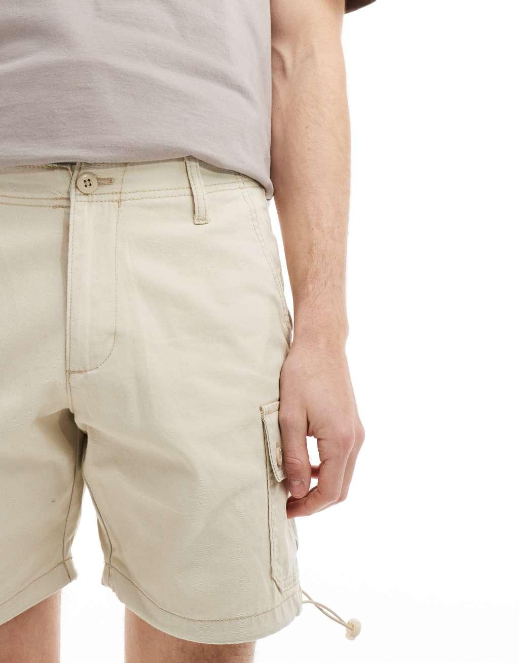 ASOS DESIGN slim cargo shorts in beige Product Image
