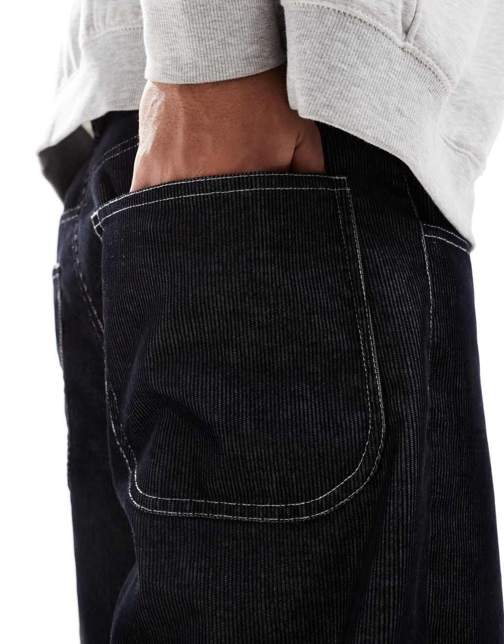 ASOS DESIGN super baggy corduroy pants with contrast stitch in black Product Image
