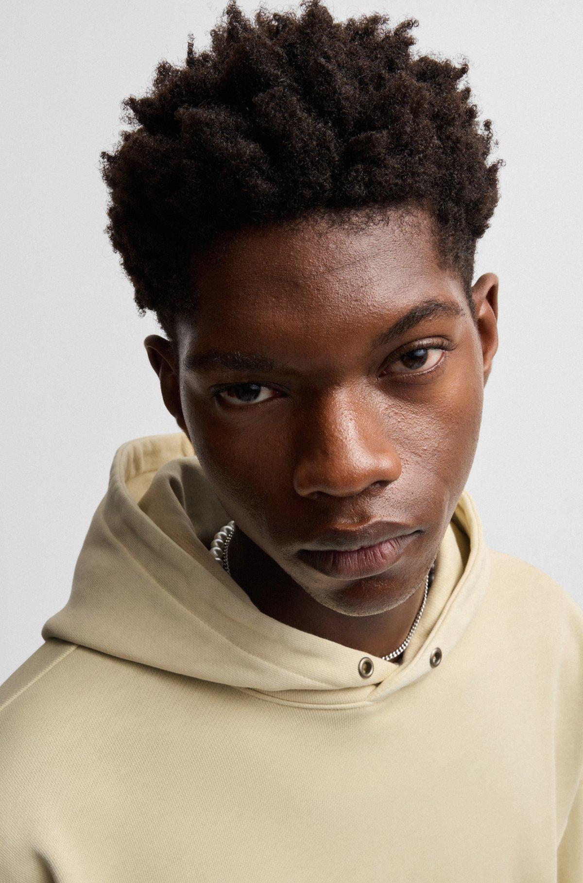 Cotton-terry hoodie with vintage eyelets Product Image