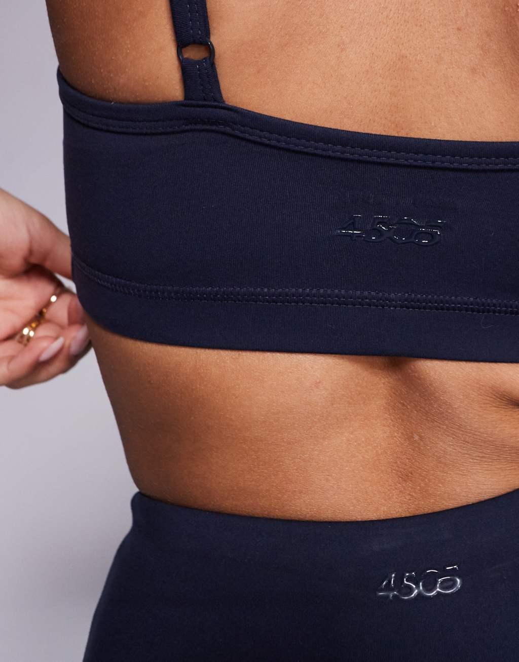 4505 Icon soft touch medium support sports bra with removable padding and adjustable straps in midnight navy  Product Image