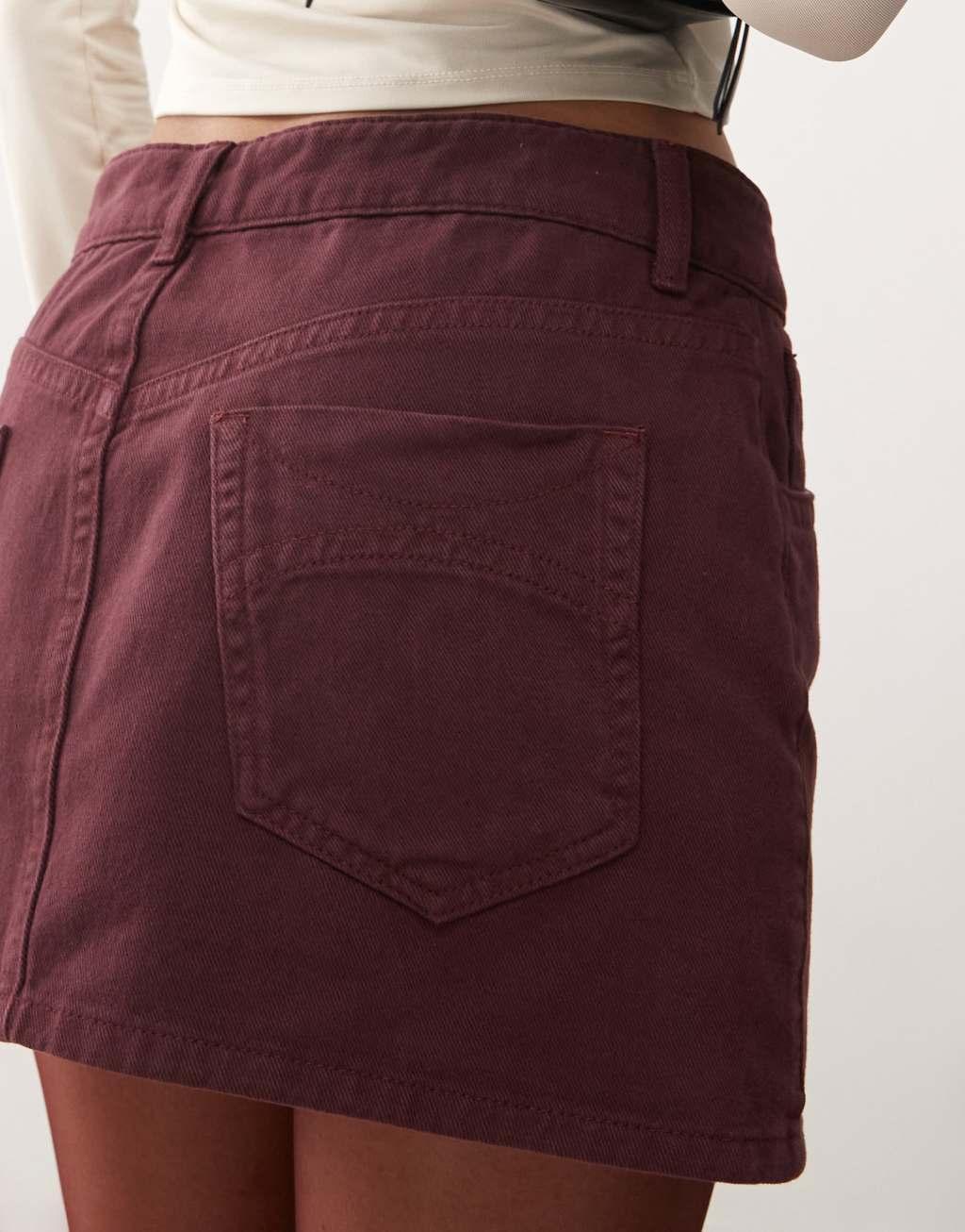 COLLUSION denim mini skirt in burgundy Product Image