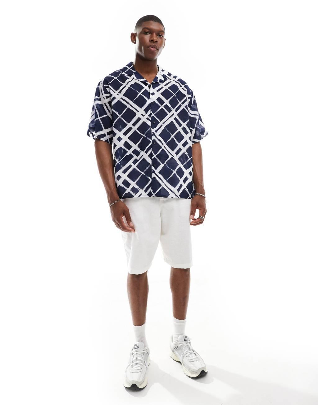 ASOS DESIGN oversized camp collar shirt with brush stroke plaid print in navy Product Image