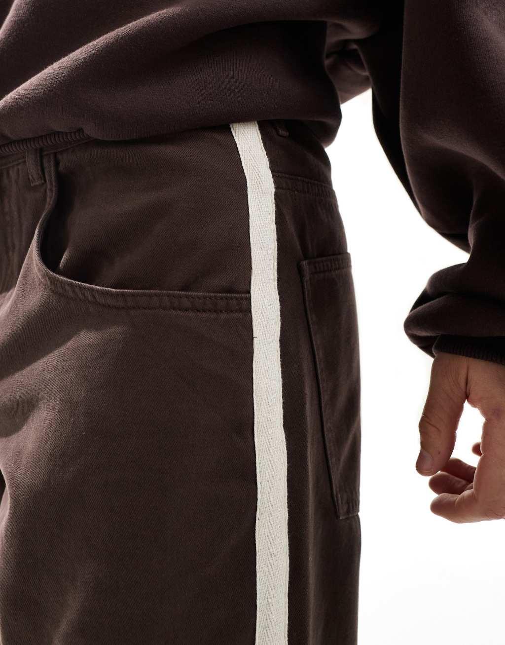 ASOS DESIGN baggy tapered pants with taped detail in brown Product Image