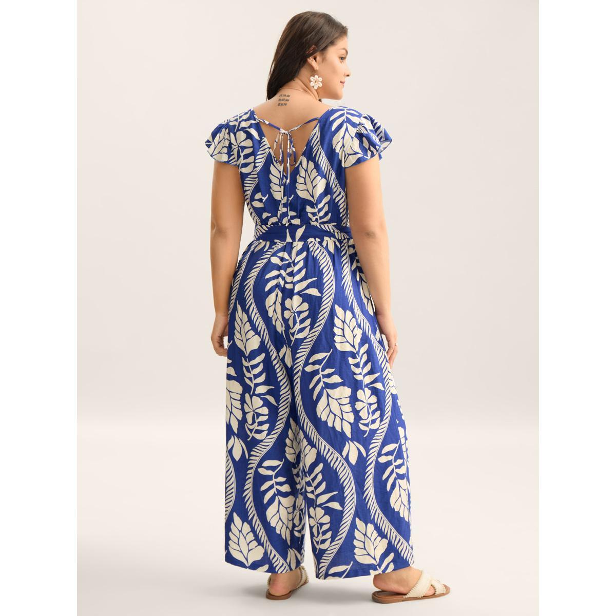 Plus Size Navy Large Floral Print Pockets Jumpsuit Women Cap Sleeve Overlap Collar Vacation Loose Jumpsuits BloomChic 12/L Product Image