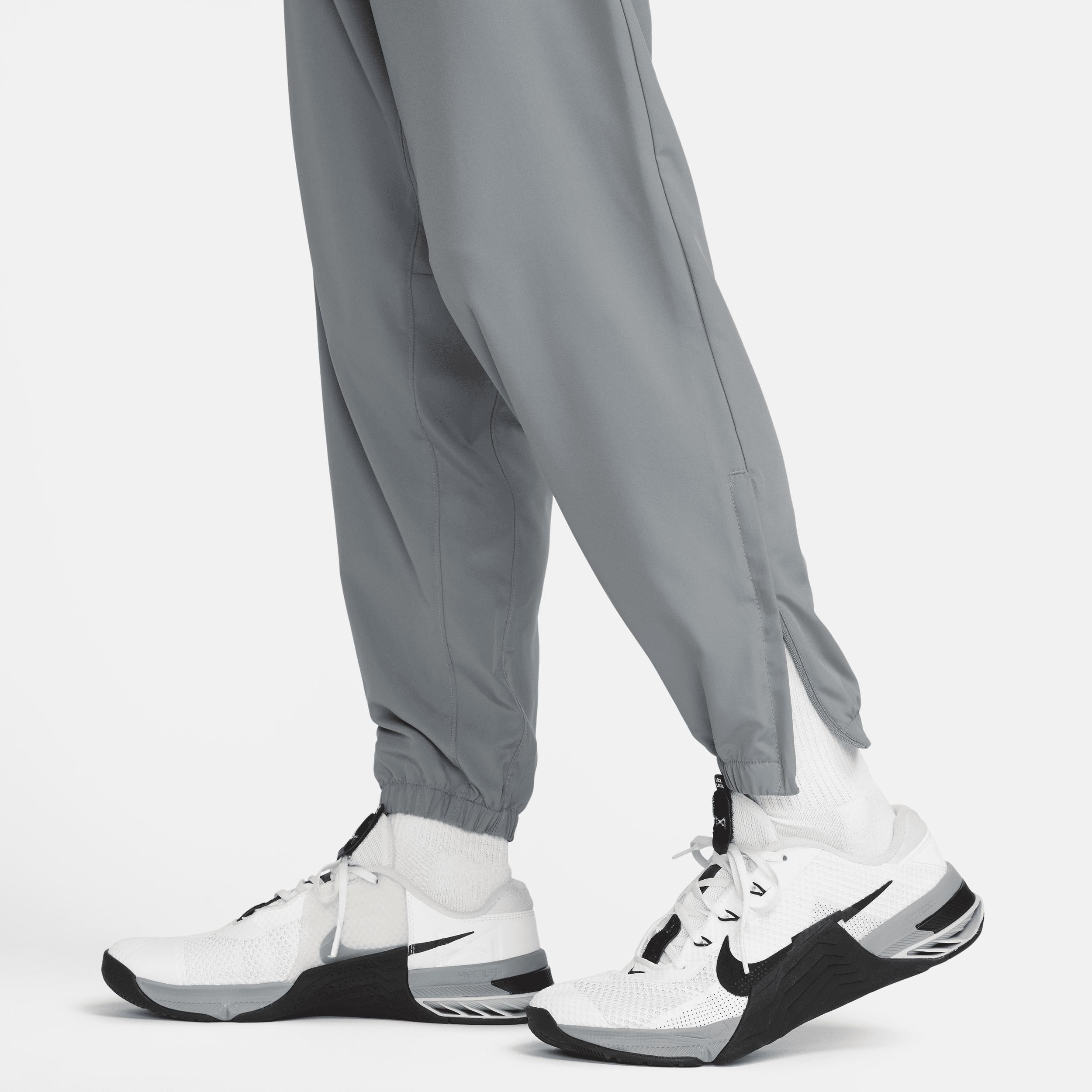 Nike Men's Form Dri-FIT Tapered Versatile Pants in Grey/Smoke Grey Size Large 100% Polyester Product Image