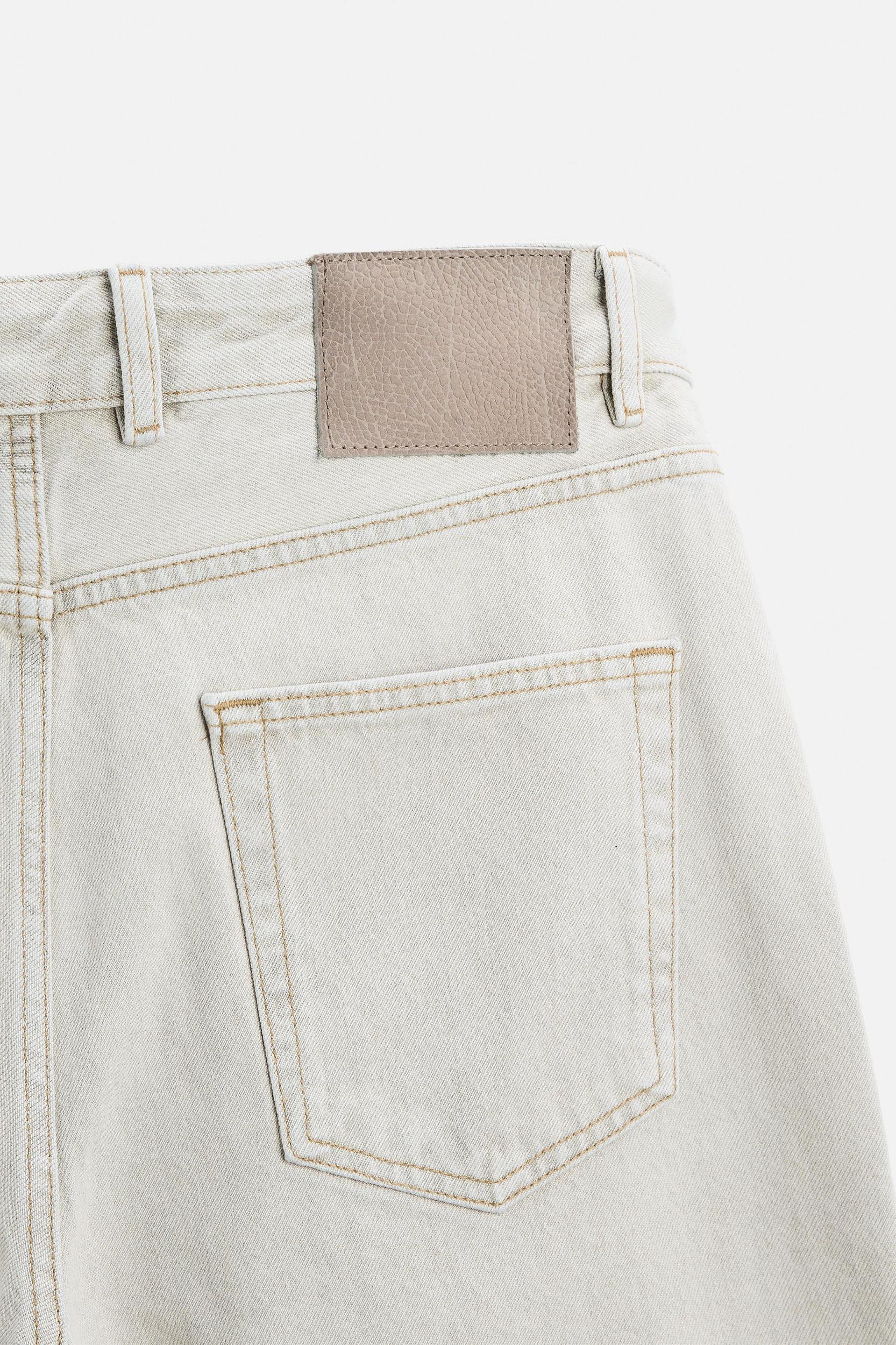 ASYMMETRIC SEAM BAGGY FIT JEANS Product Image
