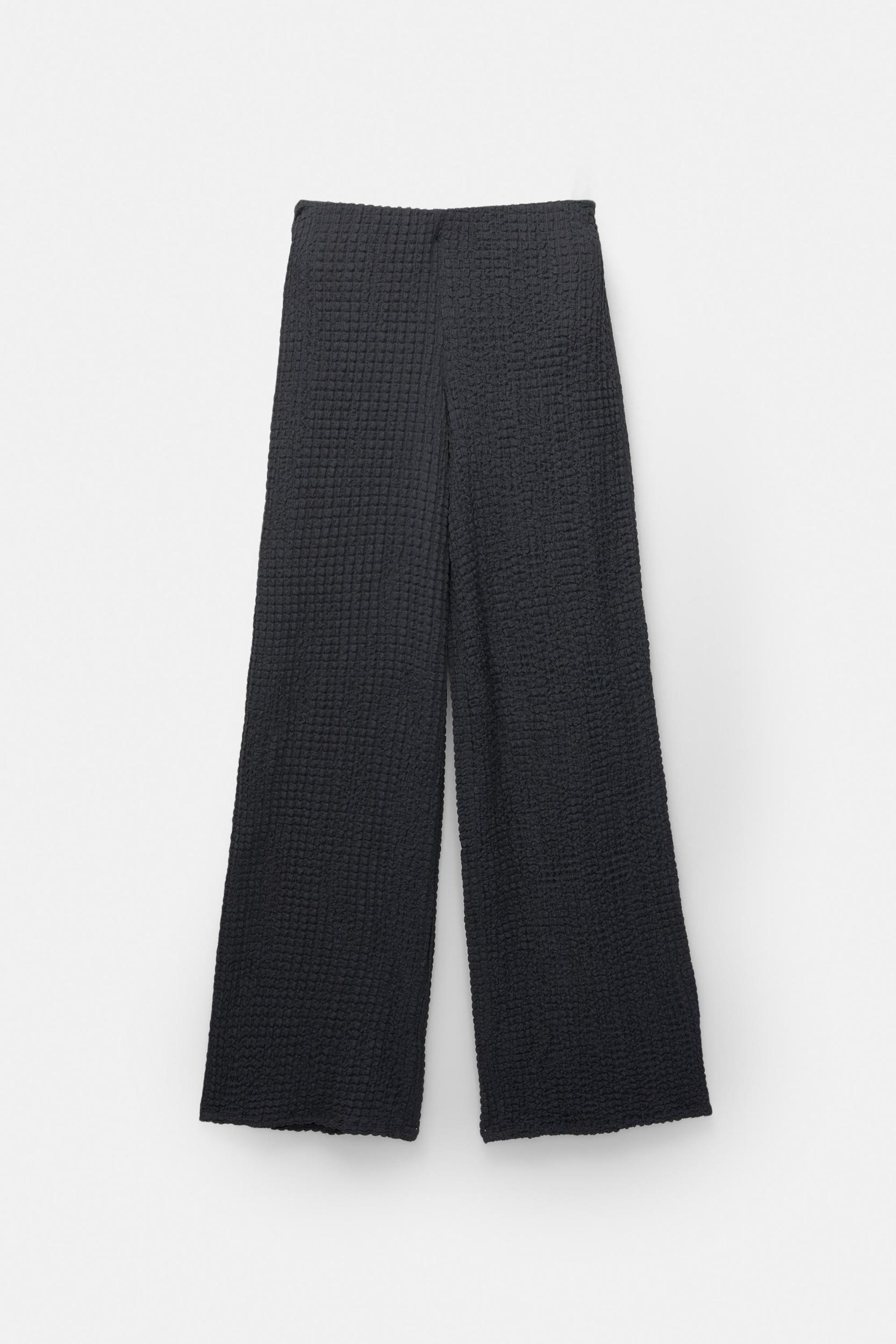 Rustic creased-effect pants Product Image