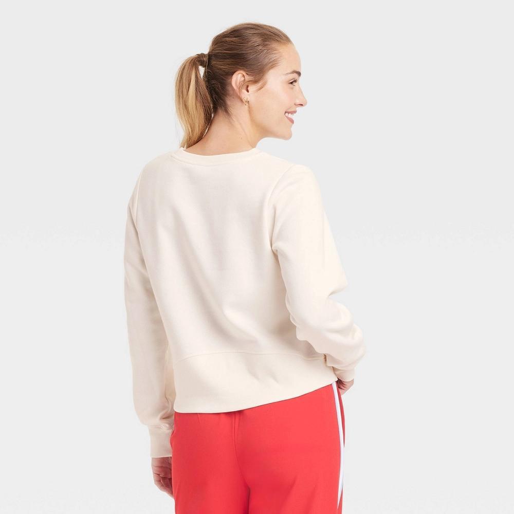 Womens Crew Neck Graphic Sweatshirt - All In Motion Cream XS: Relaxed Fit, Long Sleeve, Pullover, Thumbholes, Jersey Fleece Product Image