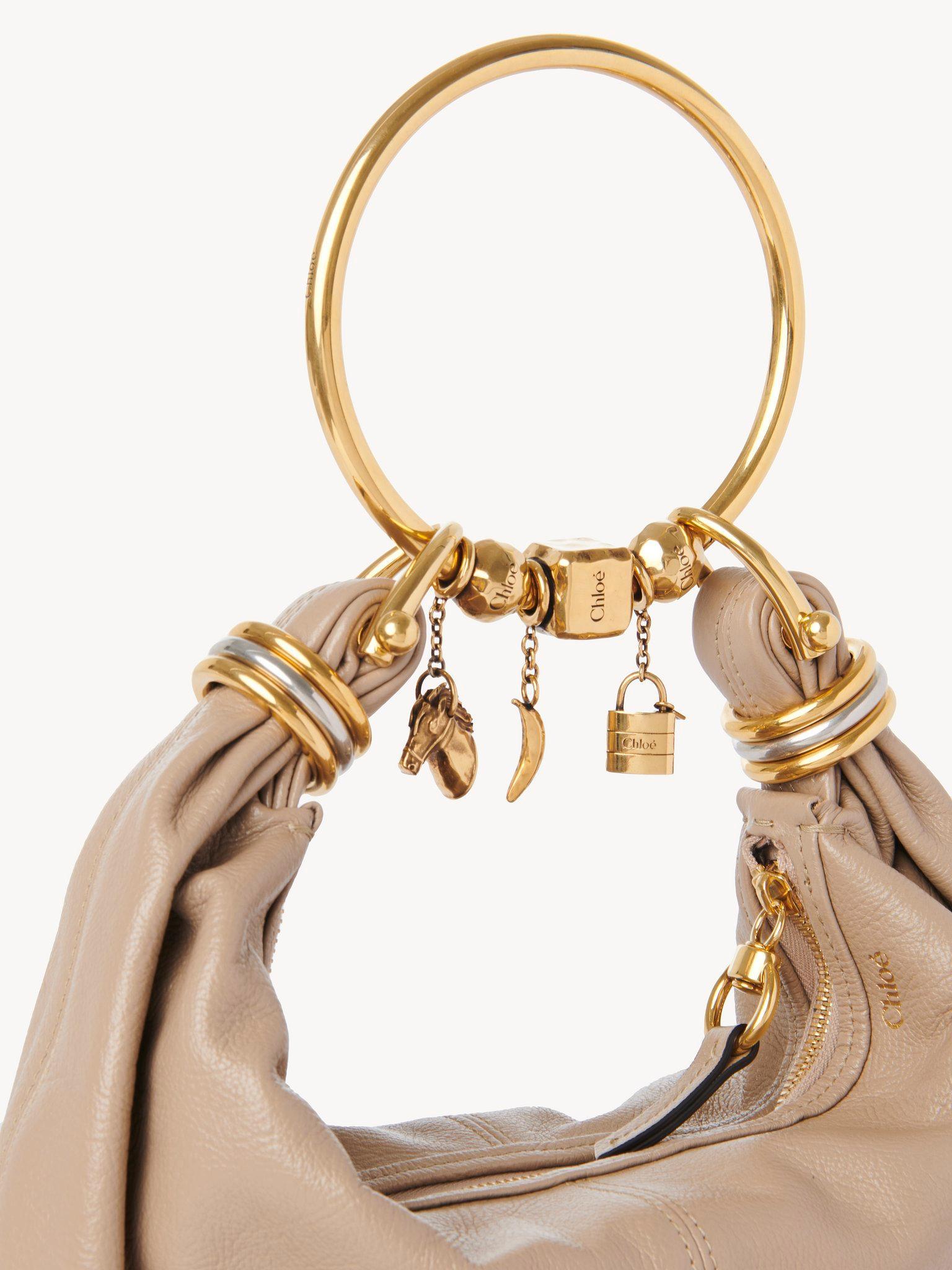 Small Bracelet hobo bag in grained leather Product Image