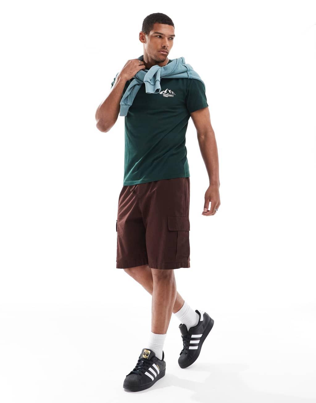 ASOS DESIGN T-shirt in dark green with chest mountain print Product Image