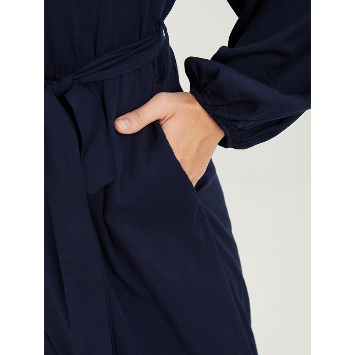 Plus Size DarkBlue Solid V Neck Lantern Sleeve Embroidered Pocket Ties Jumpsuit Women Elegant Long Sleeve V-neck Dailywear Loose Jumpsuits BloomChic 28/5X Product Image