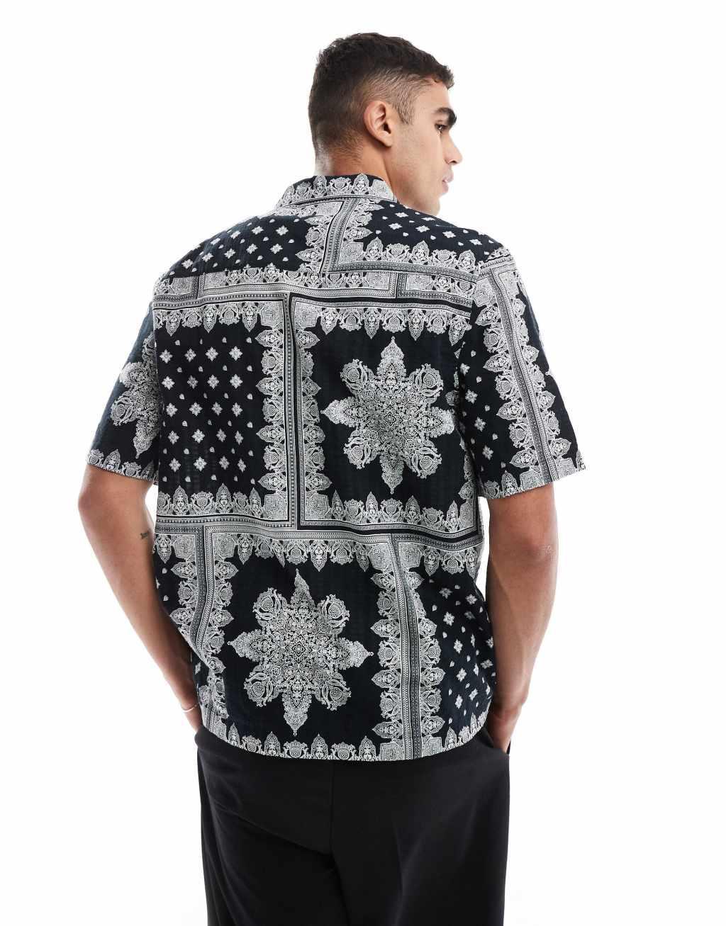 ASOS DESIGN relaxed shirt in textured bandana print in black Product Image