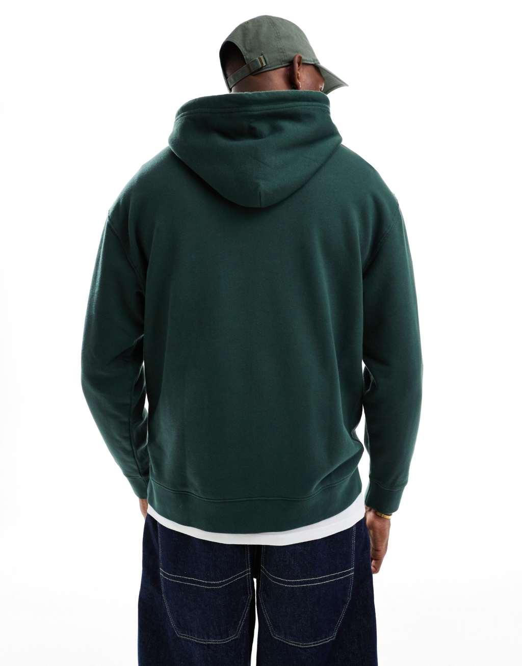 Levi's varsity applique tonal logo relaxed fit hoodie in dark green Product Image
