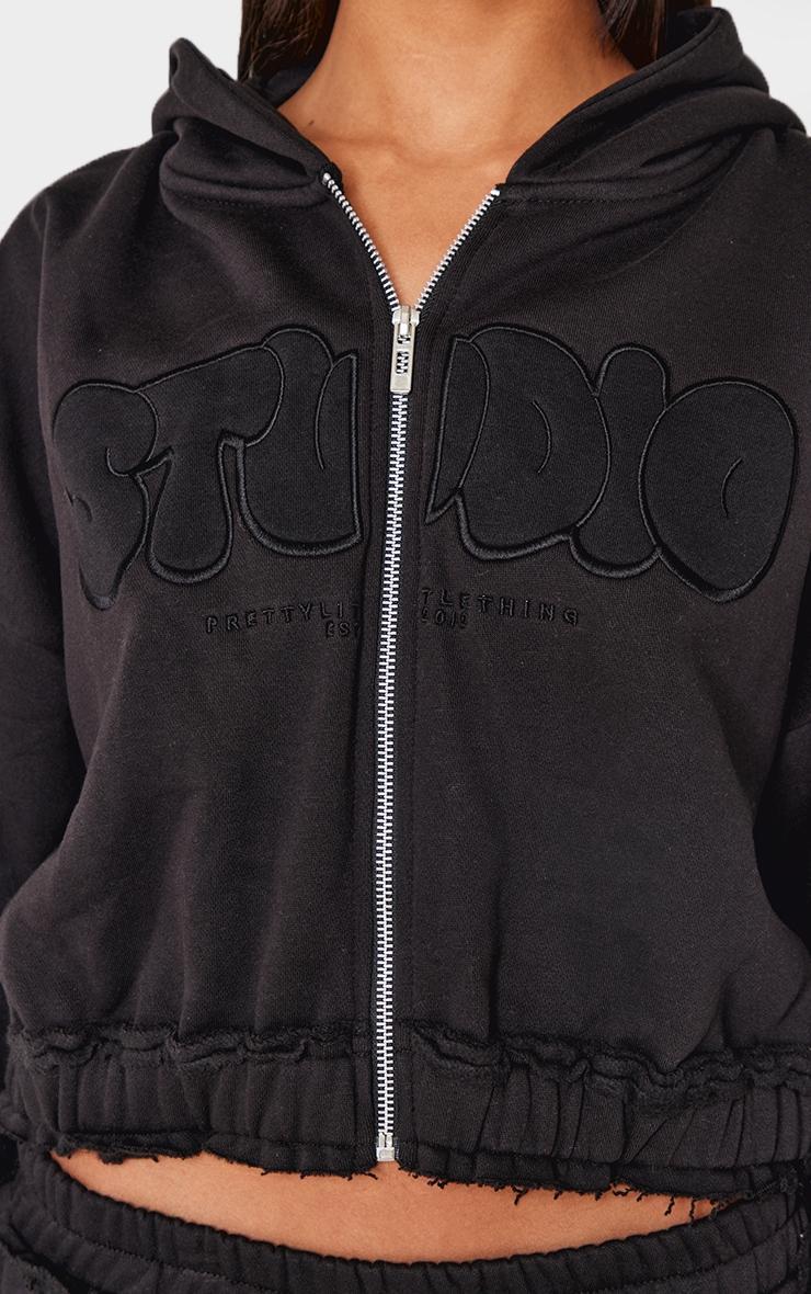 PRETTYLITTLETHING Black Studio Embroidered Raw Hem Detail Zip Up Hoodie Product Image