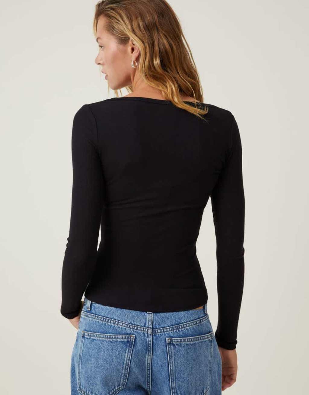 Cotton On ribbed scoop neck long sleeve top in black Product Image