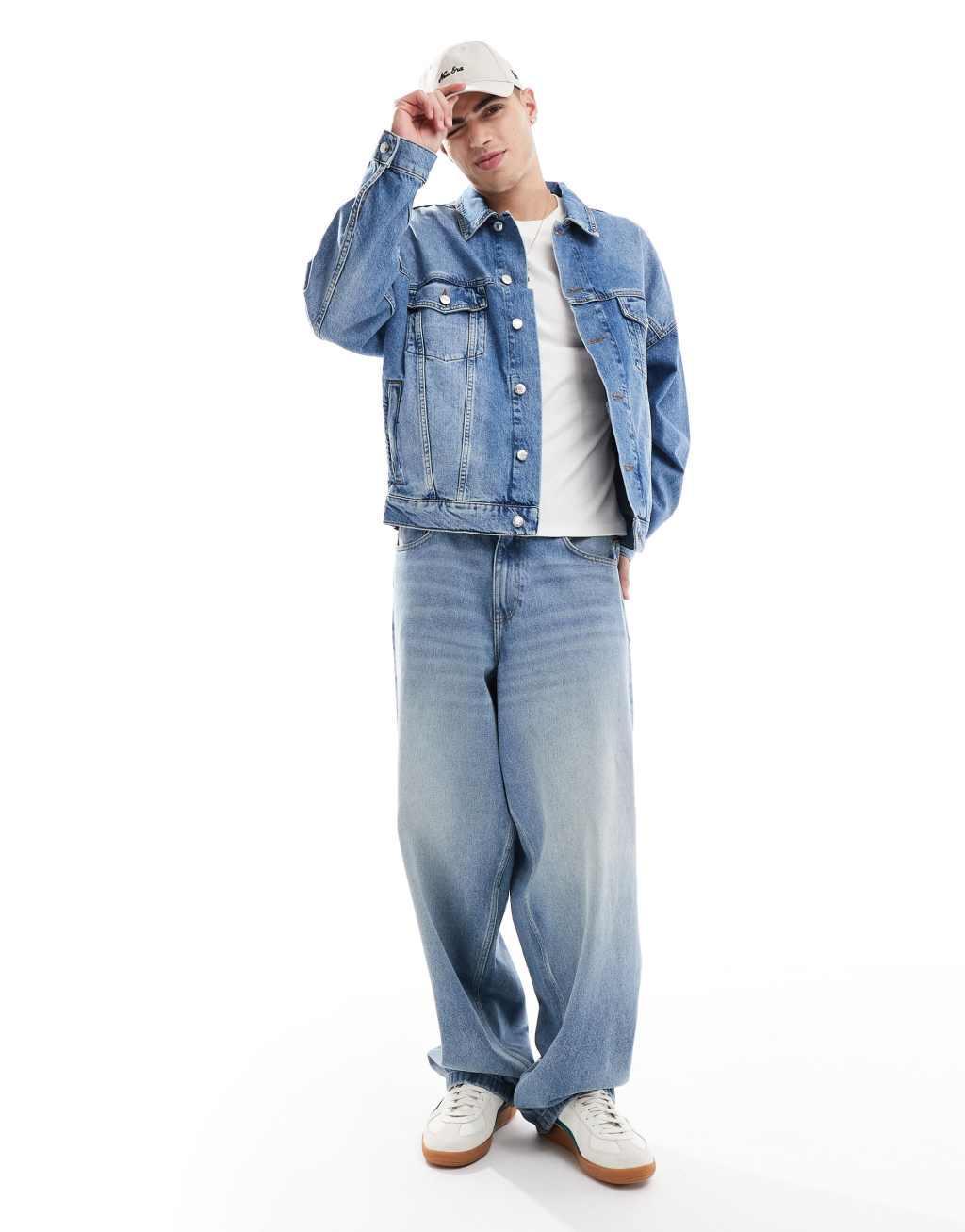 ASOS DESIGN oversized trucker jacket in mid wash blue Product Image
