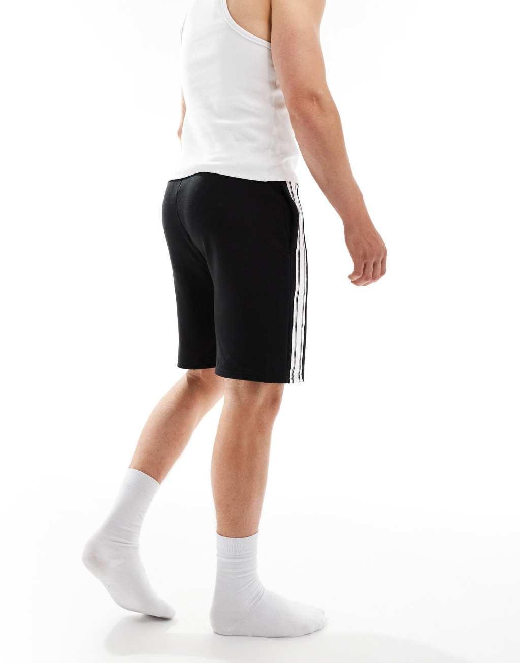 Tommy Hilfiger monotype stripe lounge shorts in black Product Image