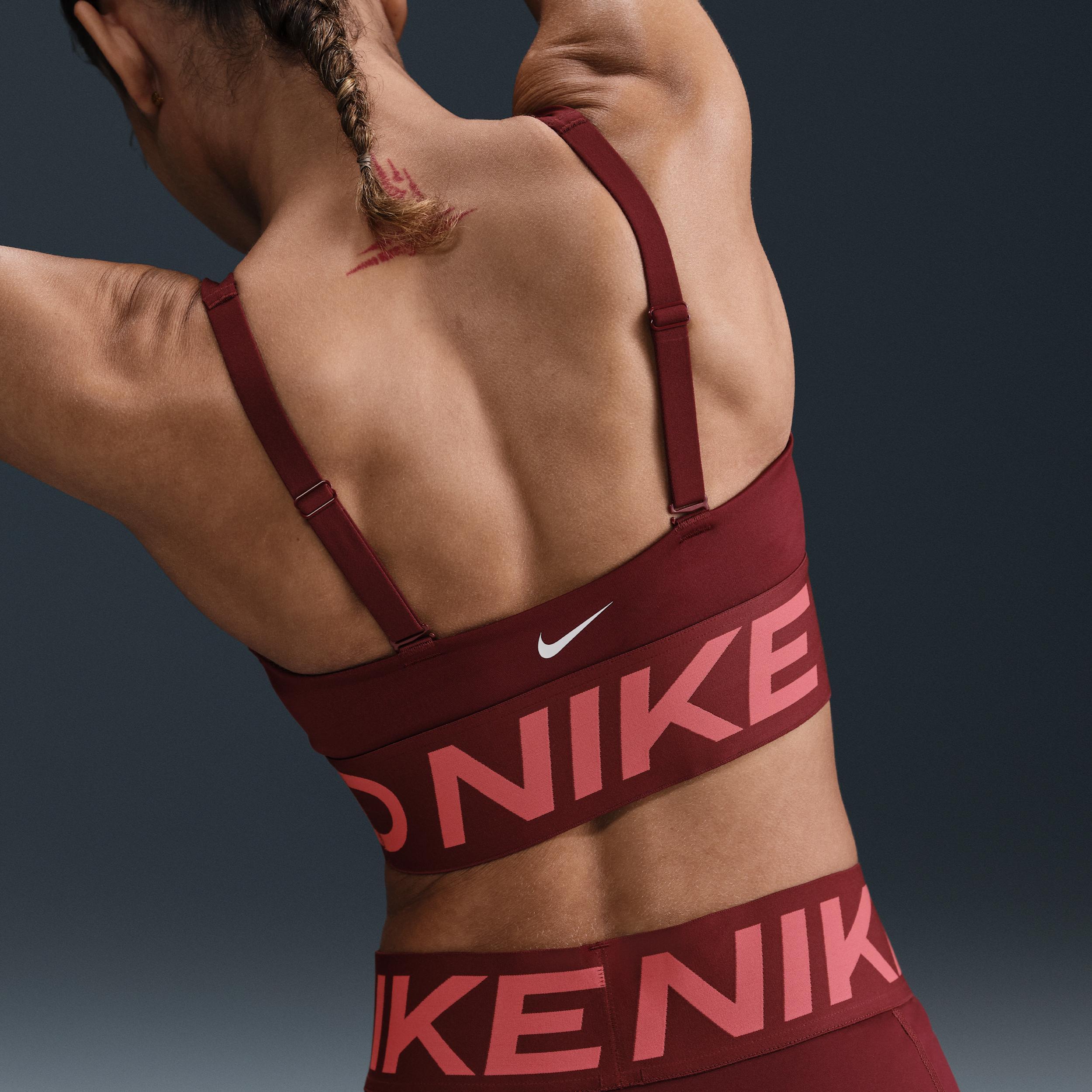 Nike Women's Pro Indy Plunge Sports Bra in Pink/Elemental Pink Size Medium Polyester/Spandex Product Image