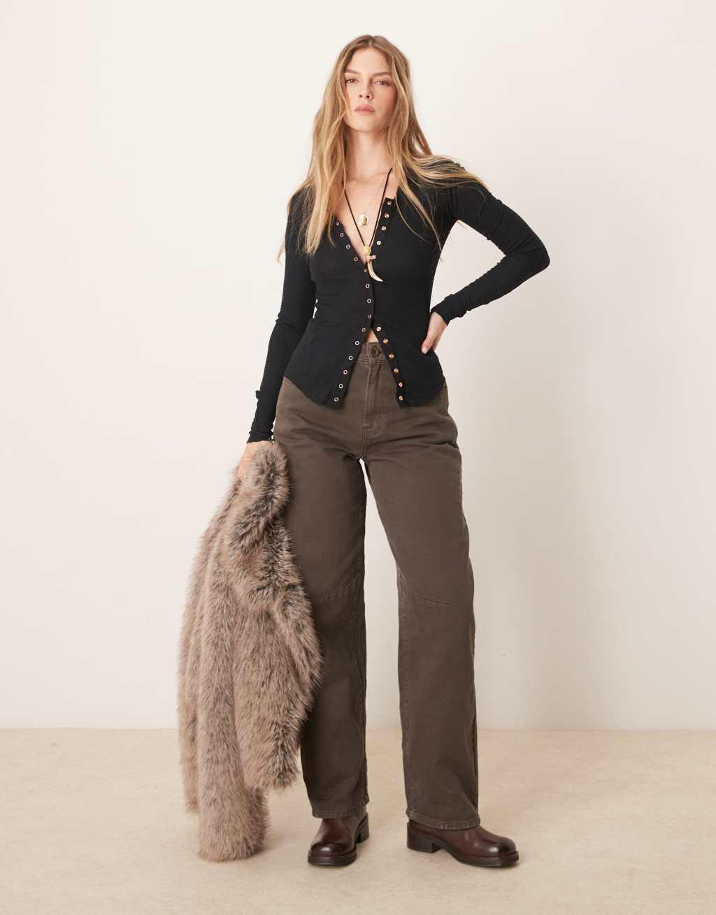 Free People going places snap detail cardigan in black Product Image