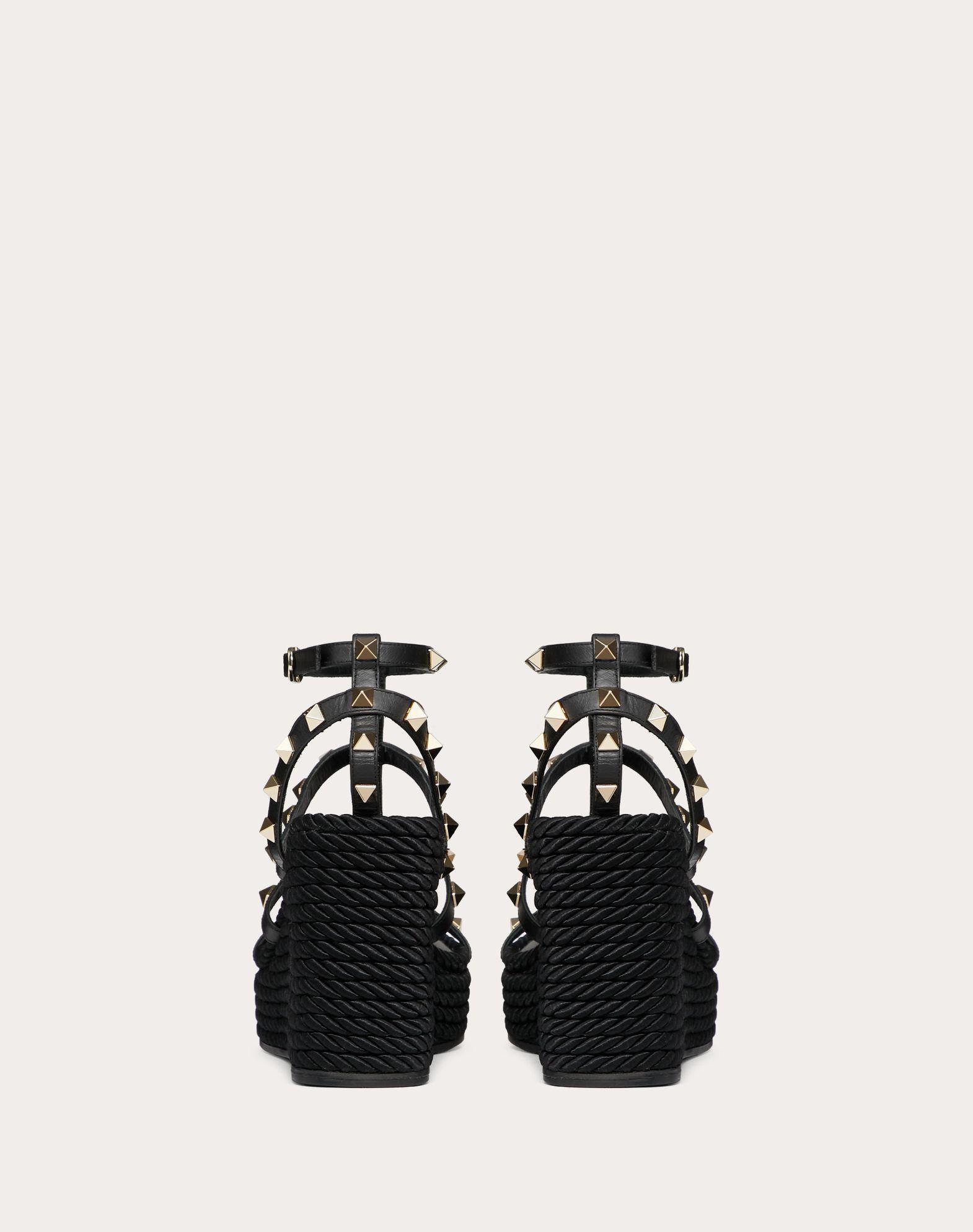 ROCKSTUD ANKLE STRAP WEDGE SANDAL IN CALFSKIN LEATHER 95 MM Product Image
