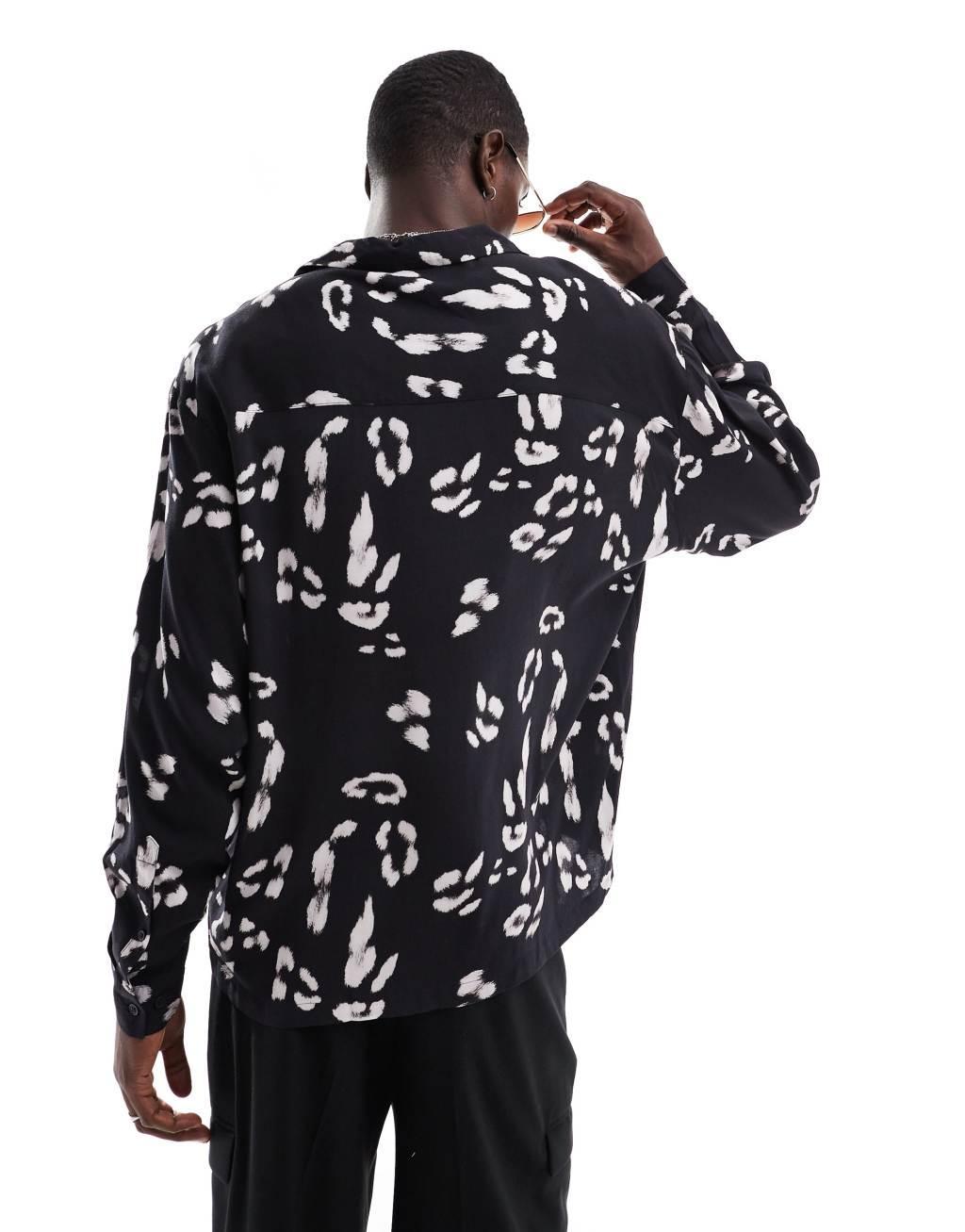 ASOS DESIGN oversized revere shirt with leopard print in black Product Image