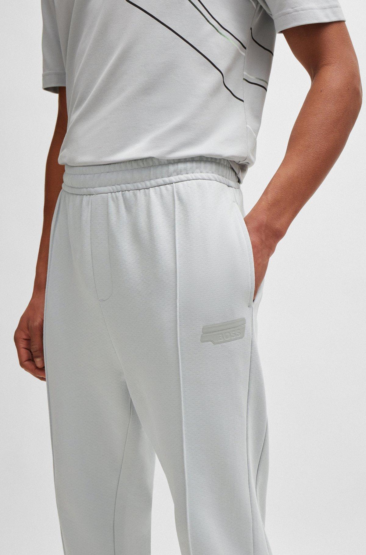 Tracksuit bottoms with logo artwork Product Image