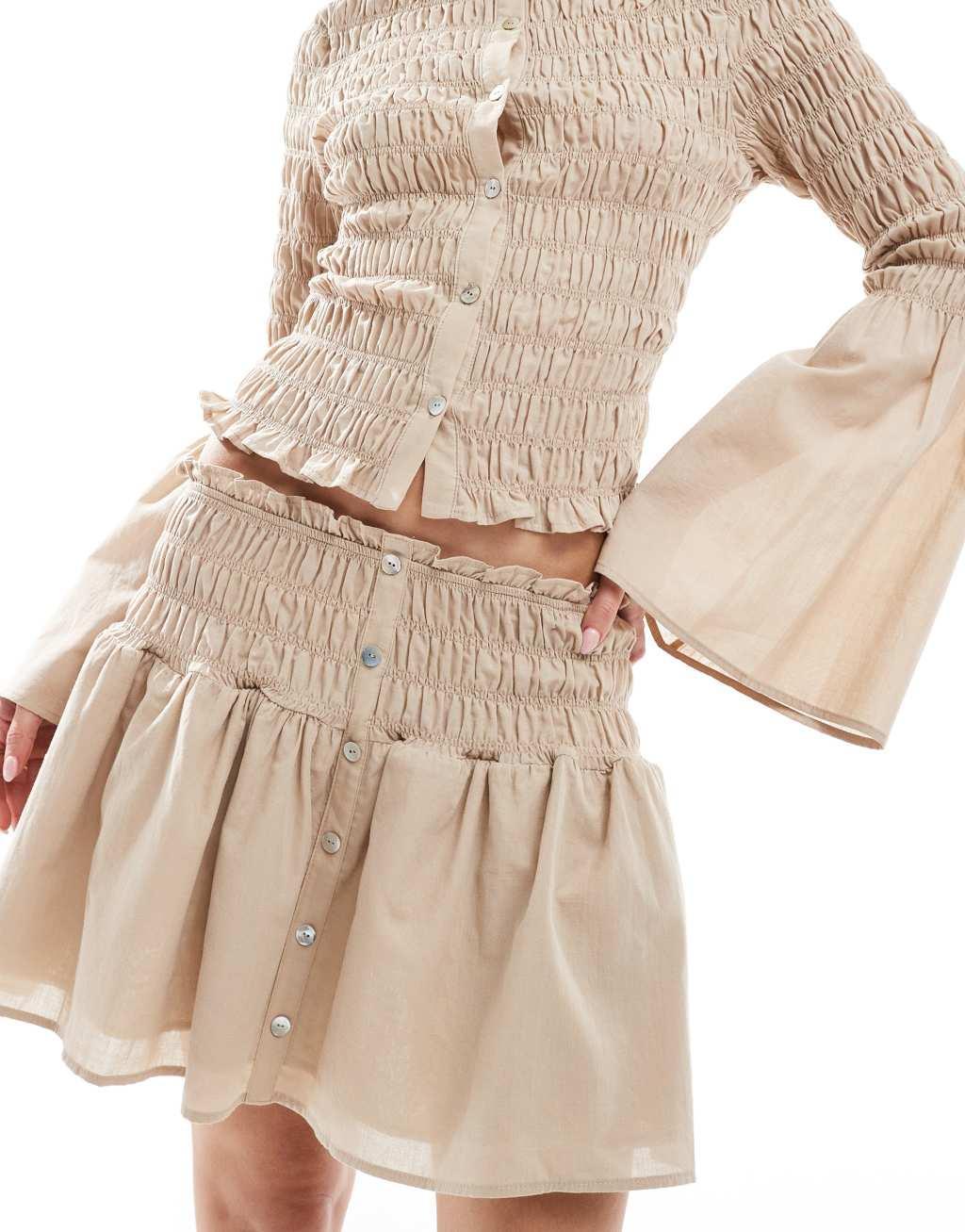 ASOS DESIGN shirred drop waist mini skirt in neutral Product Image