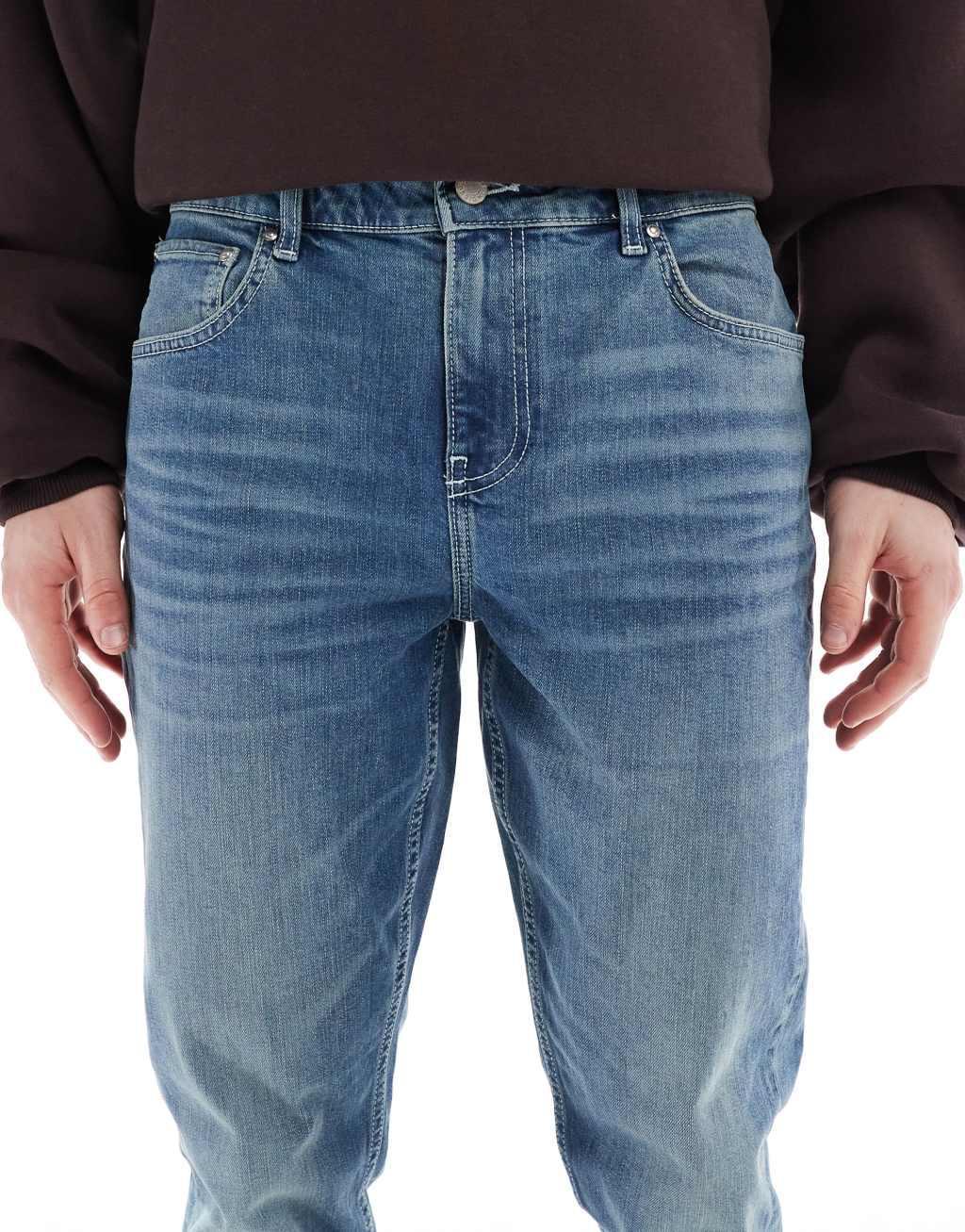 ASOS DESIGN skinny jeans with green tint in dark wash blue Product Image