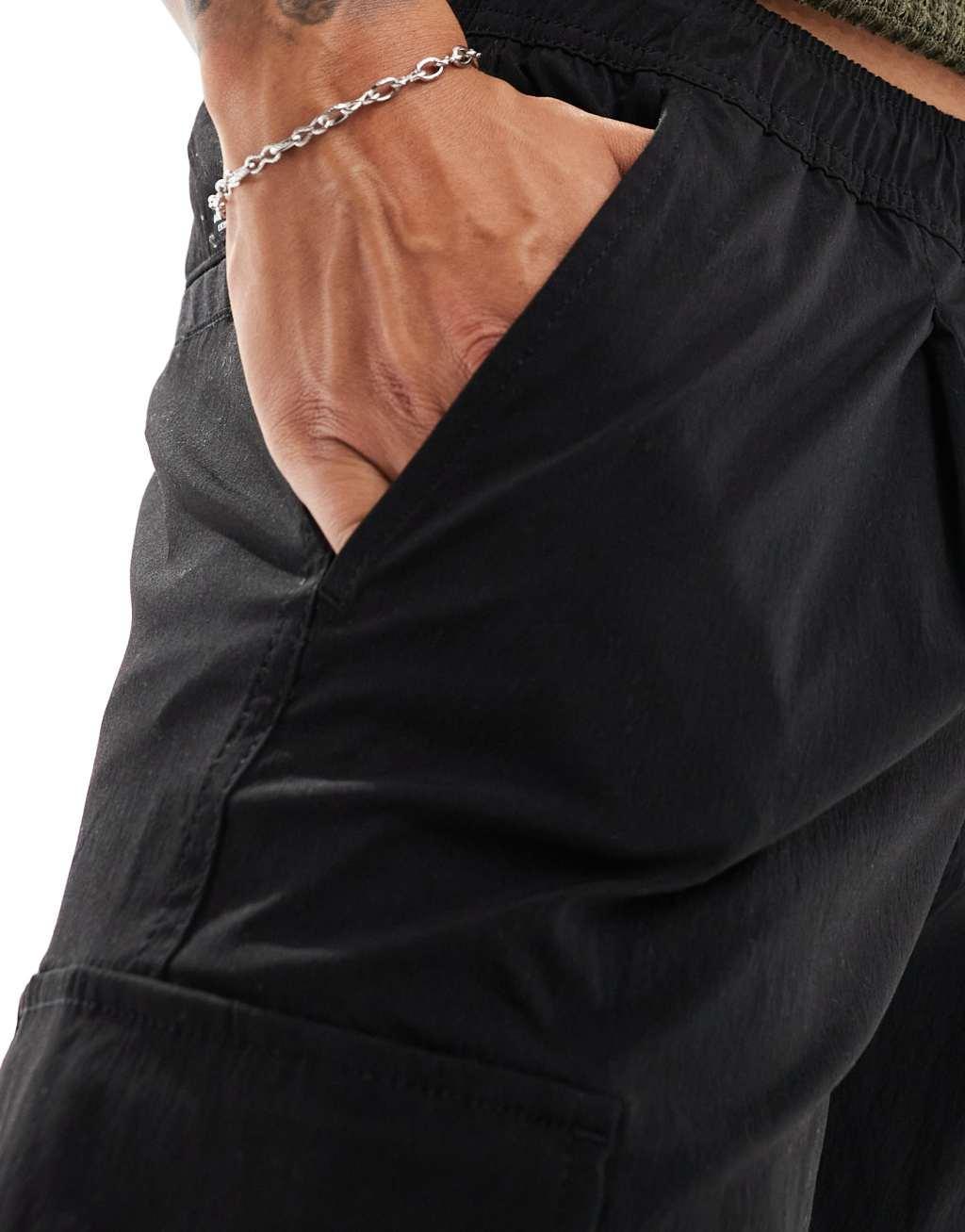 Jack & Jones bill drawstring wide fit tech cargo pants in black Product Image