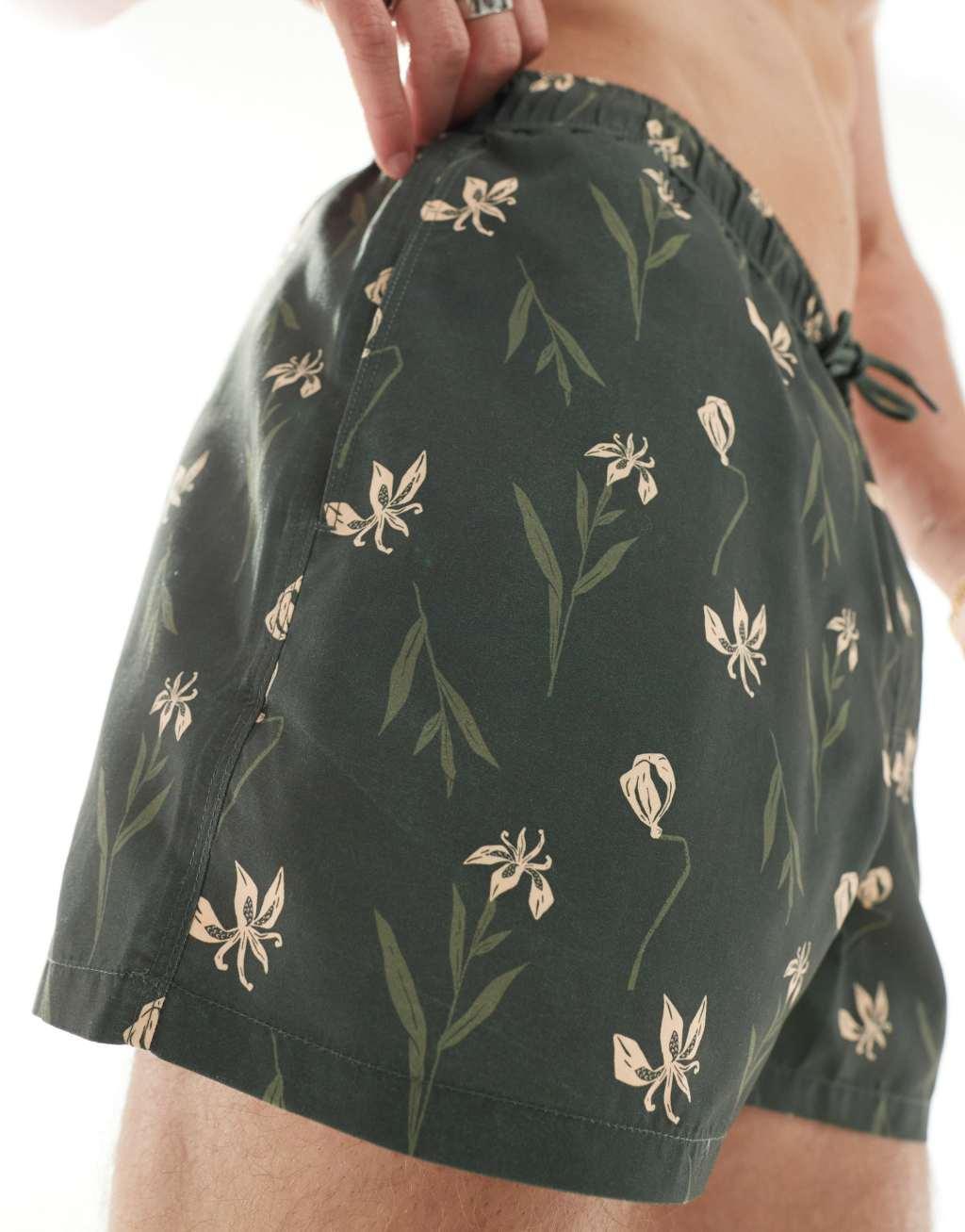 ASOS DESIGN swim shorts in short length in dark floral print Product Image