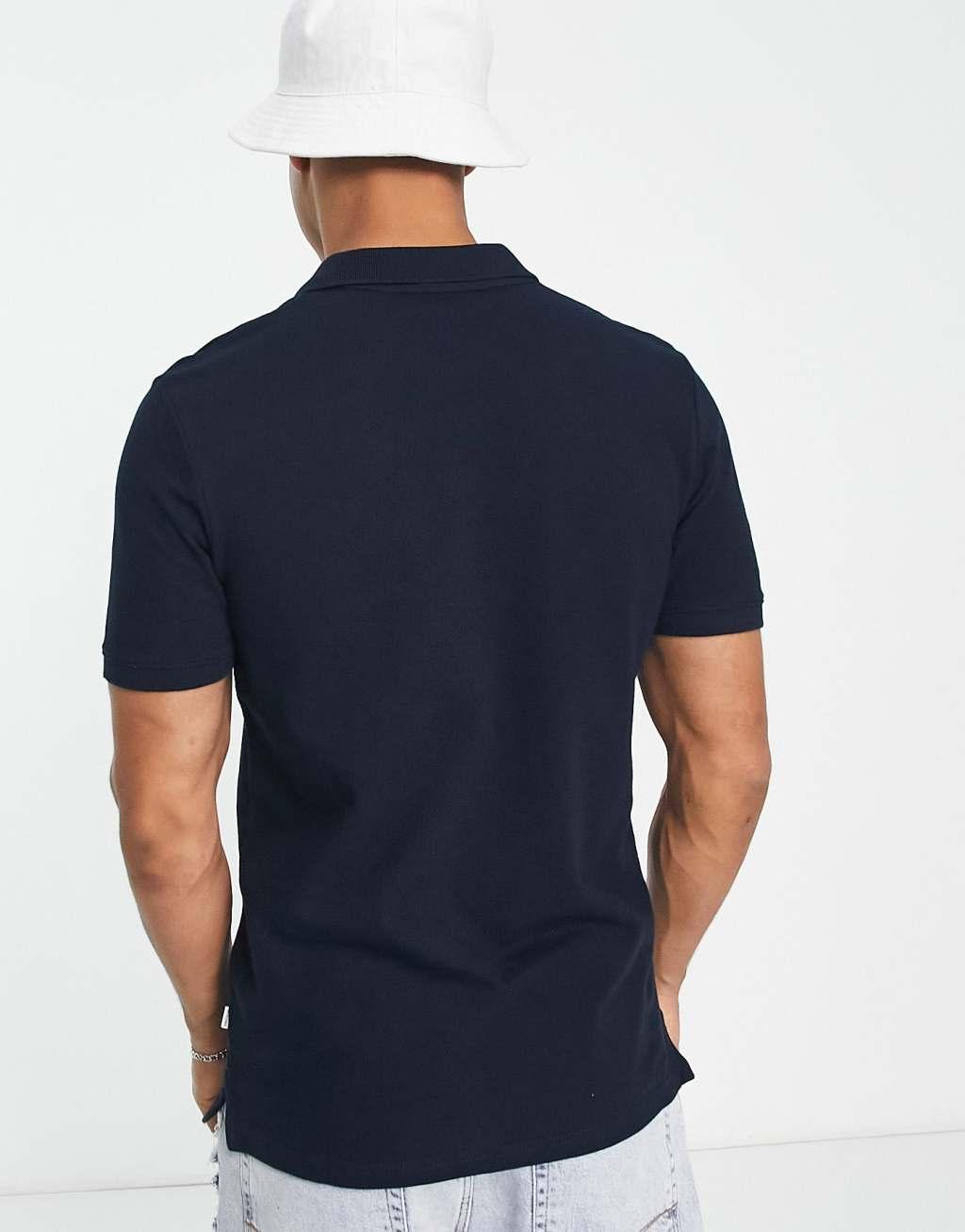 Jack & Jones Essentials slim fit pique logo polo in navy Product Image
