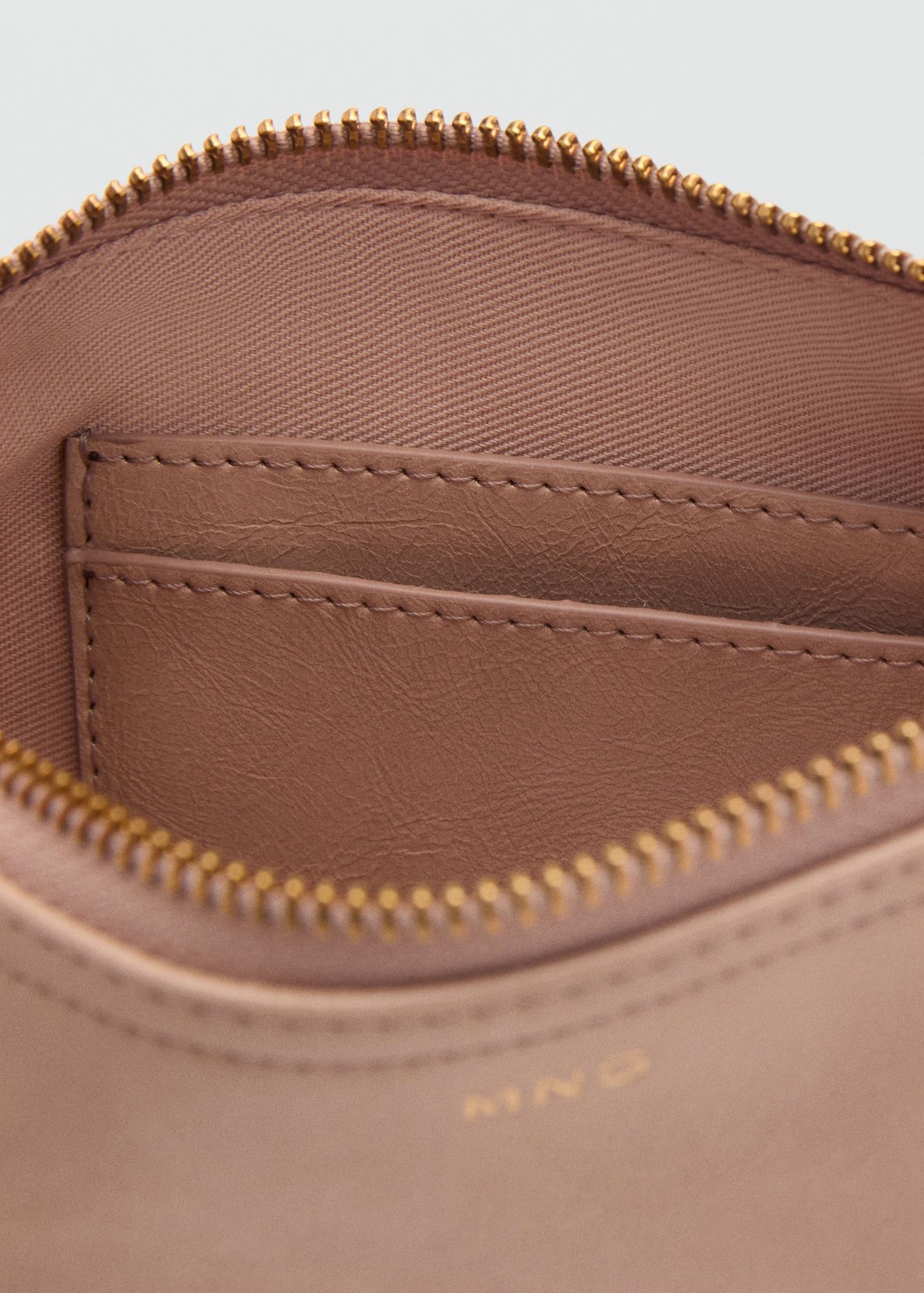 Tumbled leather-effect clutch - Women | MANGO USA Product Image