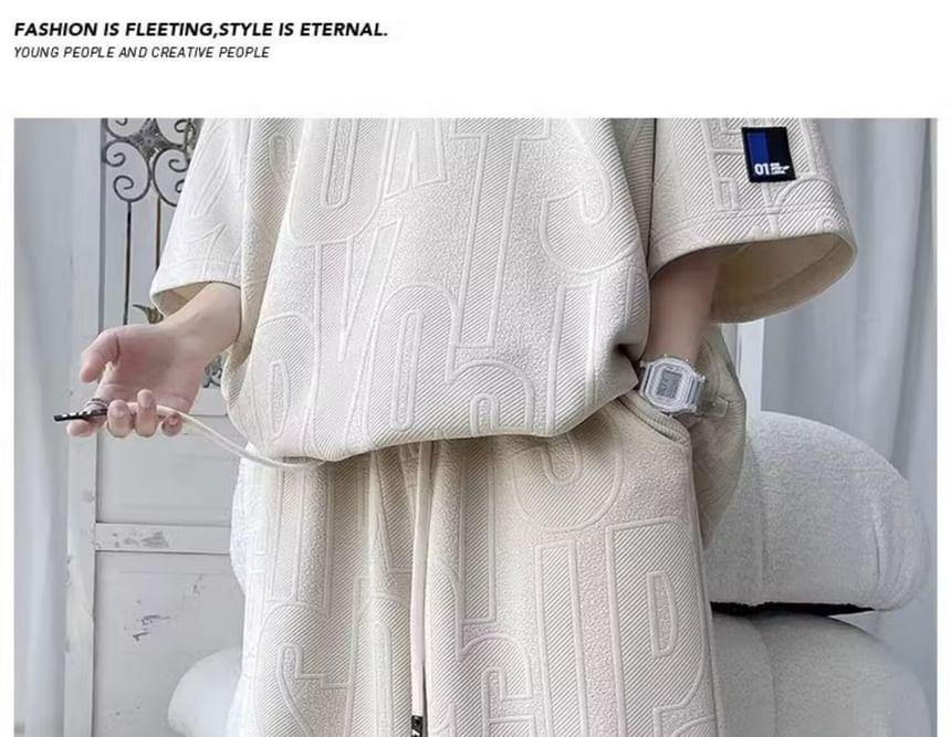 Set: Elbow-Sleeve Crew Neck Lettering Embossed Applique T-Shirt + Drawstring Waist Sweat Shorts Product Image