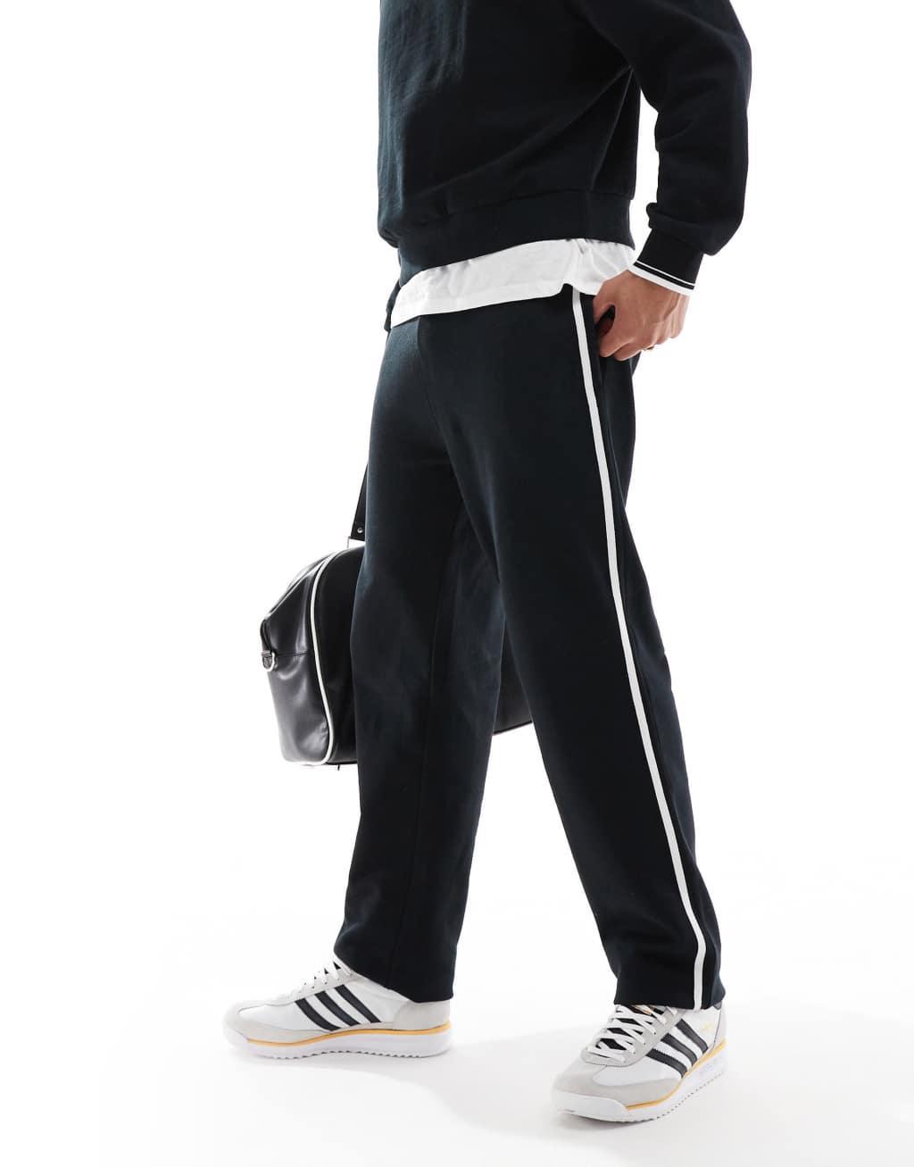 ASOS DESIGN straight leg sweatpants with textured side stripes in black Product Image