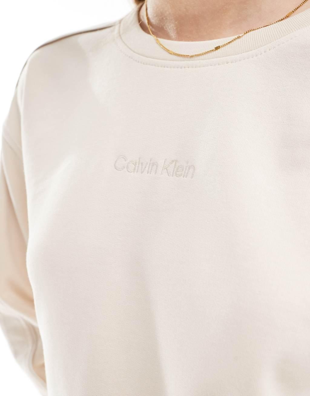 Calvin Klein Tonal Logo lounge crew neck sweatshirt in cream Product Image