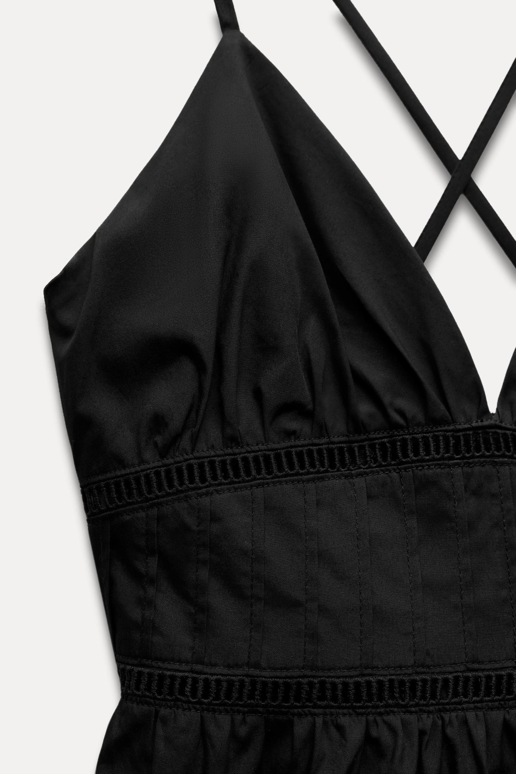 V-neck dress with thin straps that cross at back. Tonal lace insert detail. Side hidden in-seam zip closure. Product Image