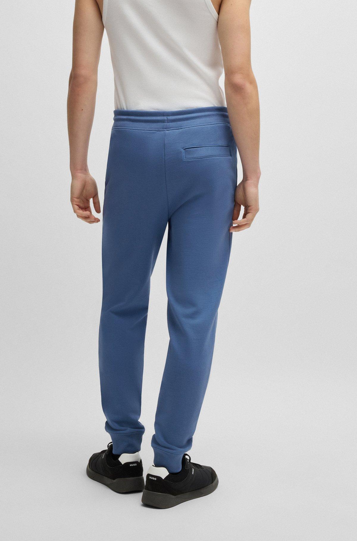 Cotton-terry tracksuit bottoms with logo label Product Image