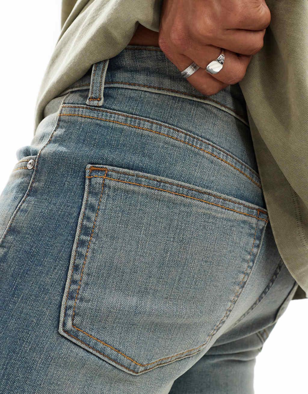 ASOS DESIGN skinny jeans with extreme tint in mid wash blue Product Image