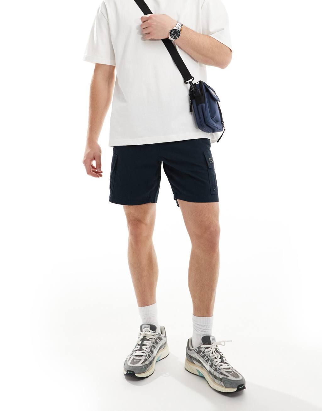 ASOS DESIGN slim cargo shorts in regular length with patch in navy Product Image