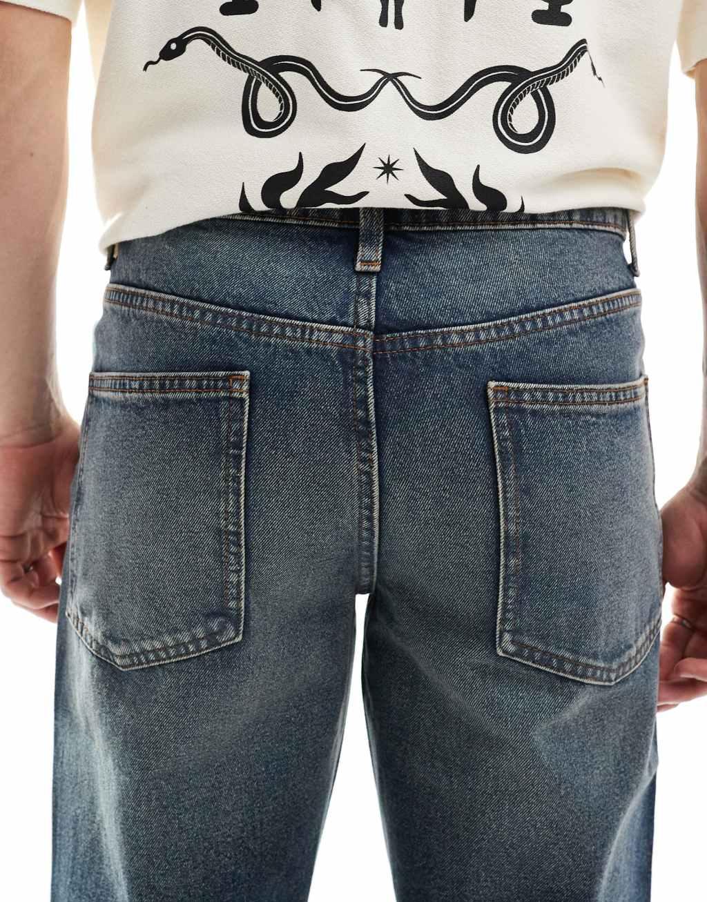 ASOS DESIGN tapered fit jeans in mid wash blue with tint  Product Image