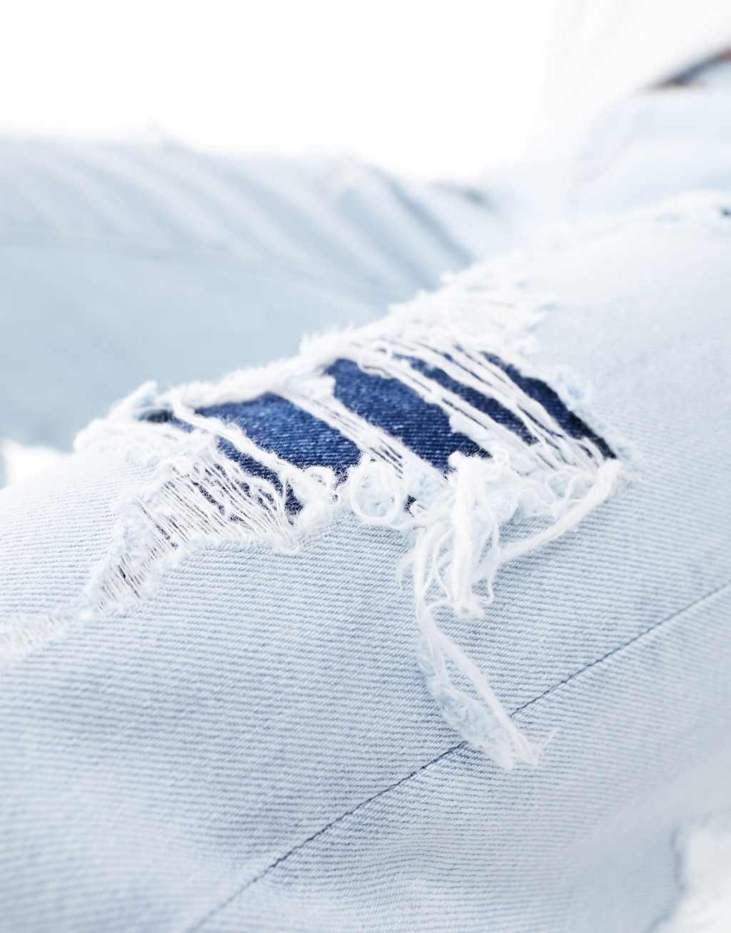ASOS DESIGN straight leg jeans with rip repair detail Product Image