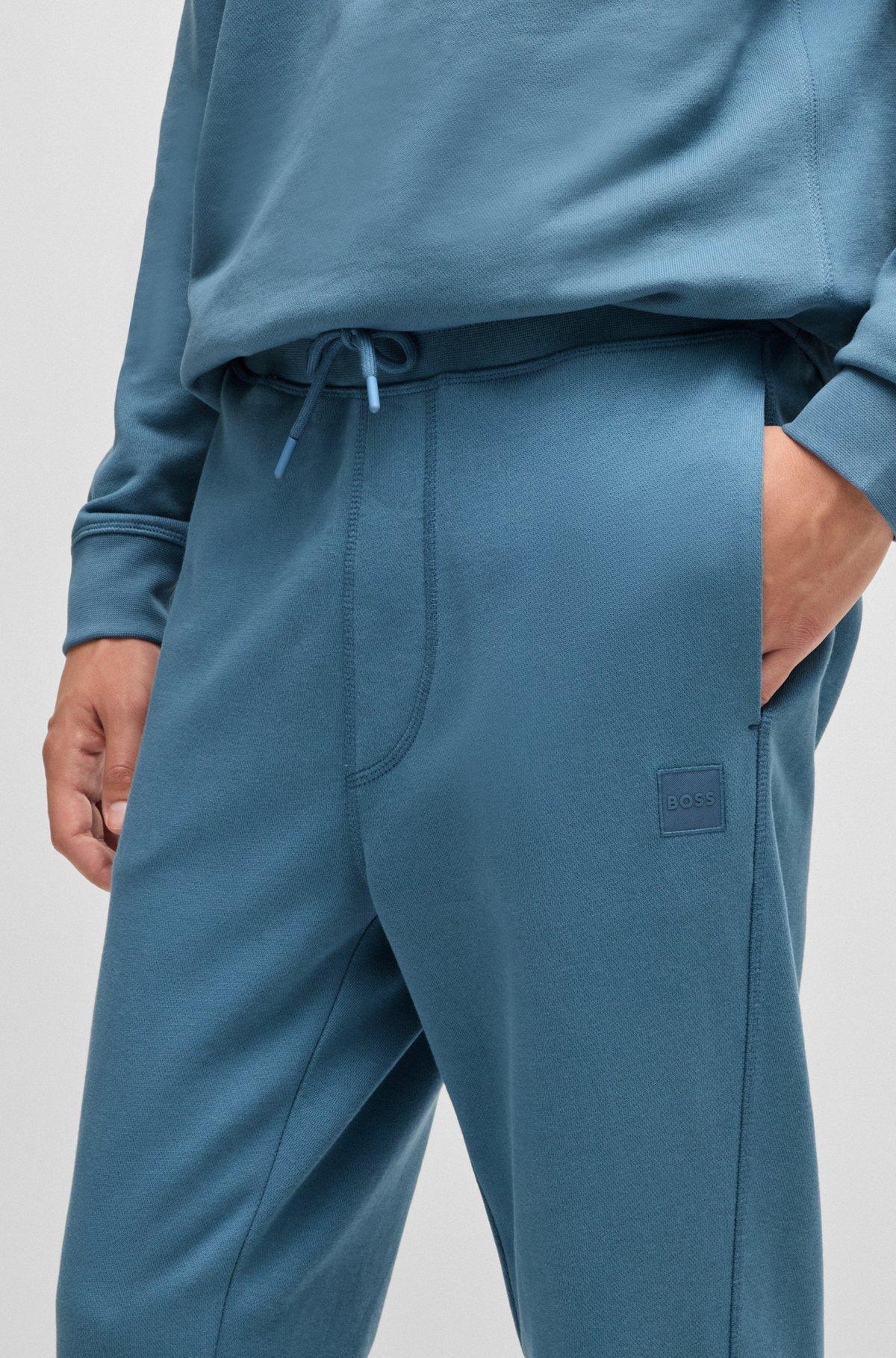 Cotton-terry tracksuit bottoms with logo patch Product Image