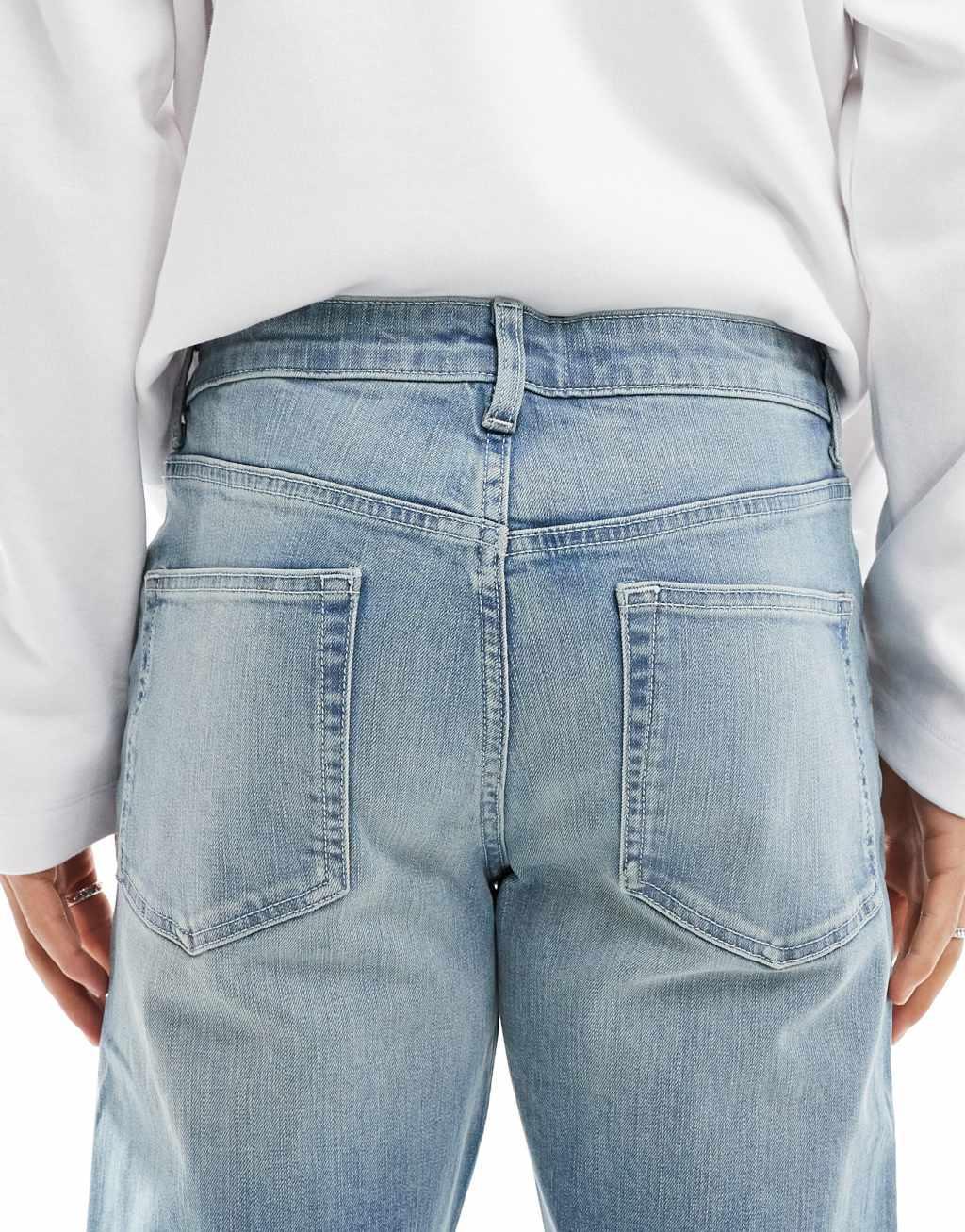 ASOS DESIGN slim jeans with tint in light wash blue Product Image