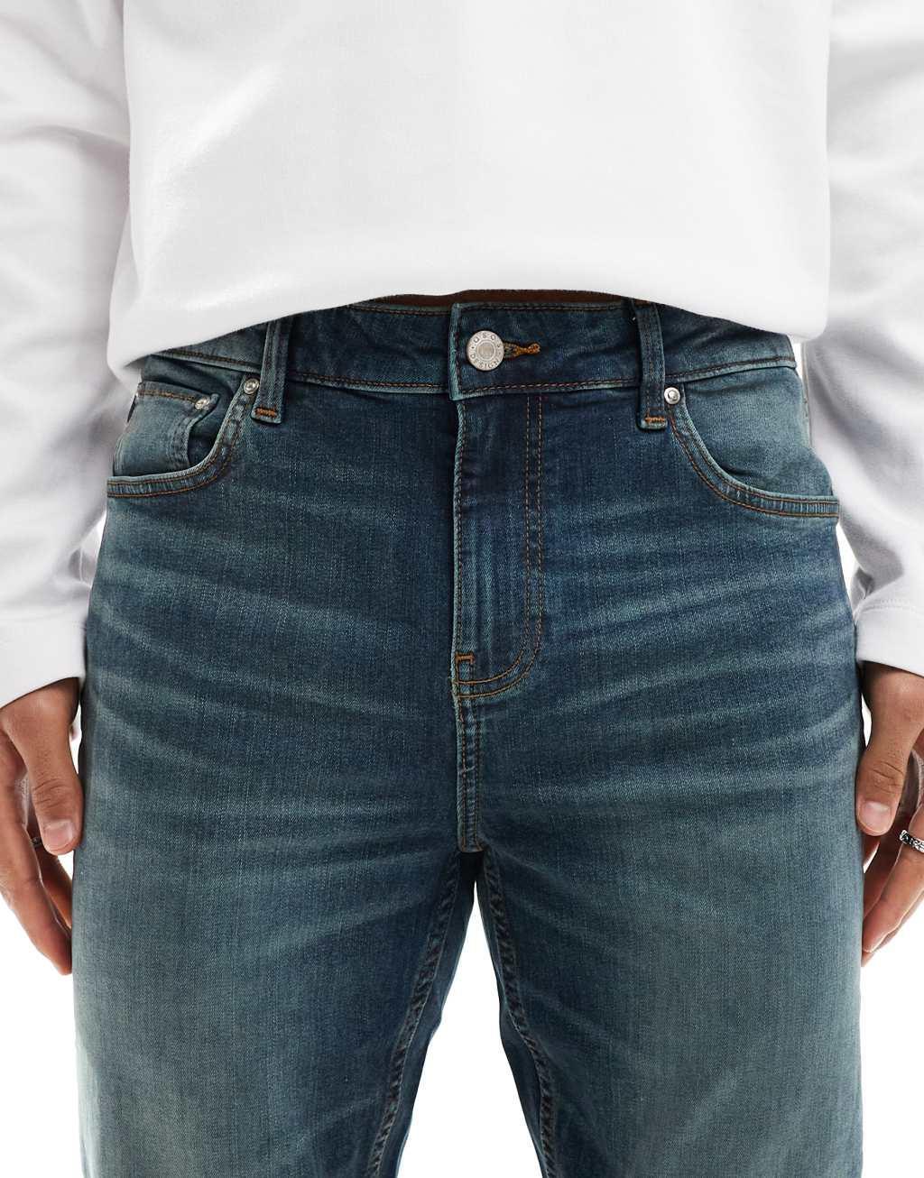 ASOS DESIGN skinny jeans with green tint in mid wash blue Product Image