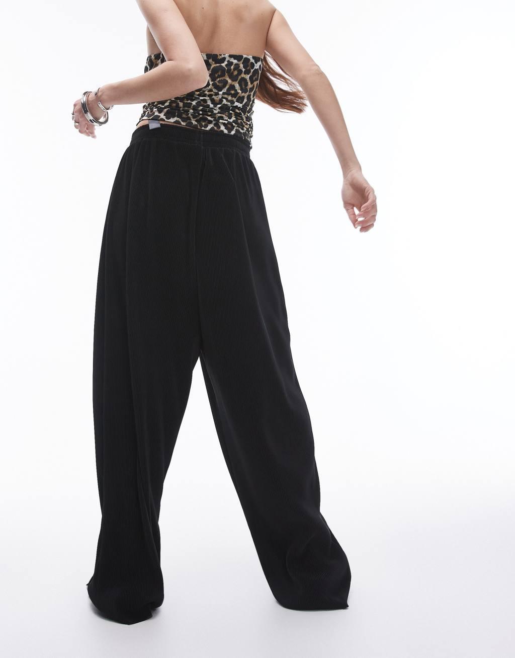 Topshop plisse balloon leg pants in black Product Image