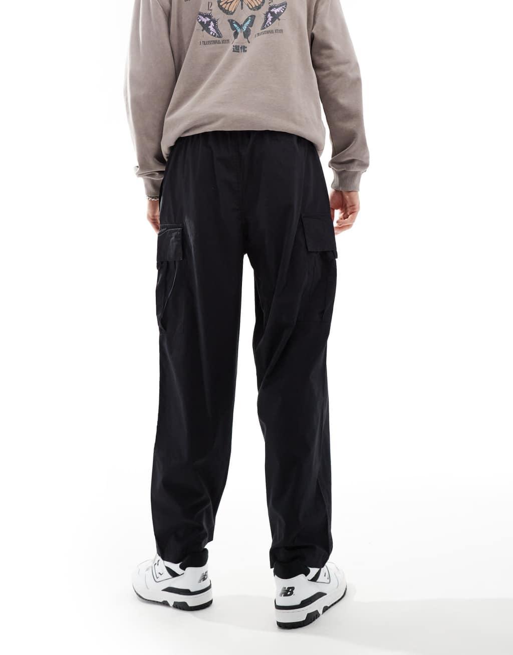 Another Influence wide leg parachute cargo pants in black Product Image