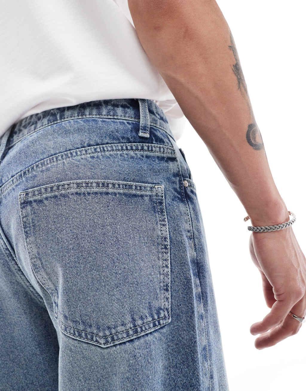 ASOS DESIGN tapered fit jeans in mid wash blue  Product Image