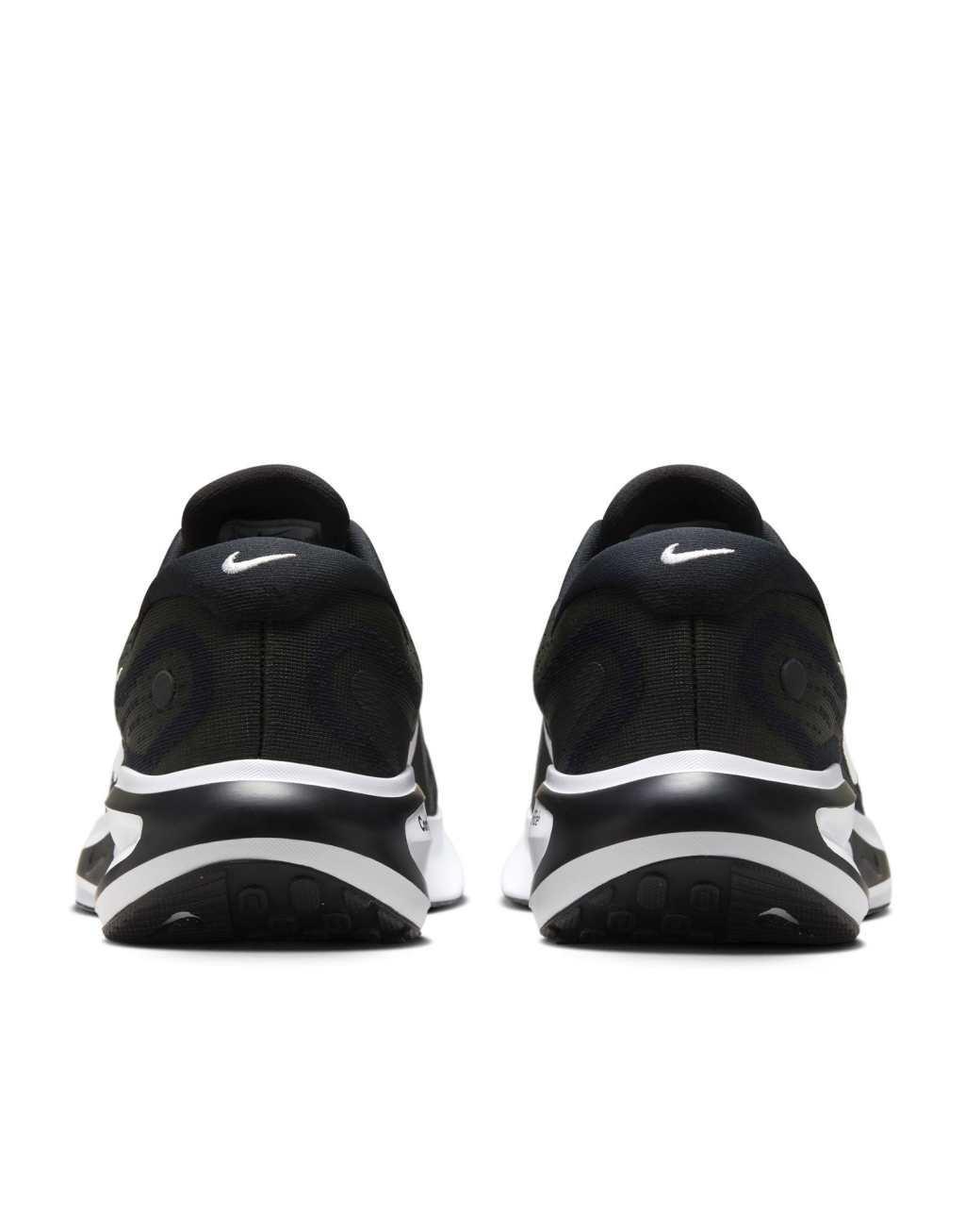 Nike Running Journey Run sneakers in black and white Product Image