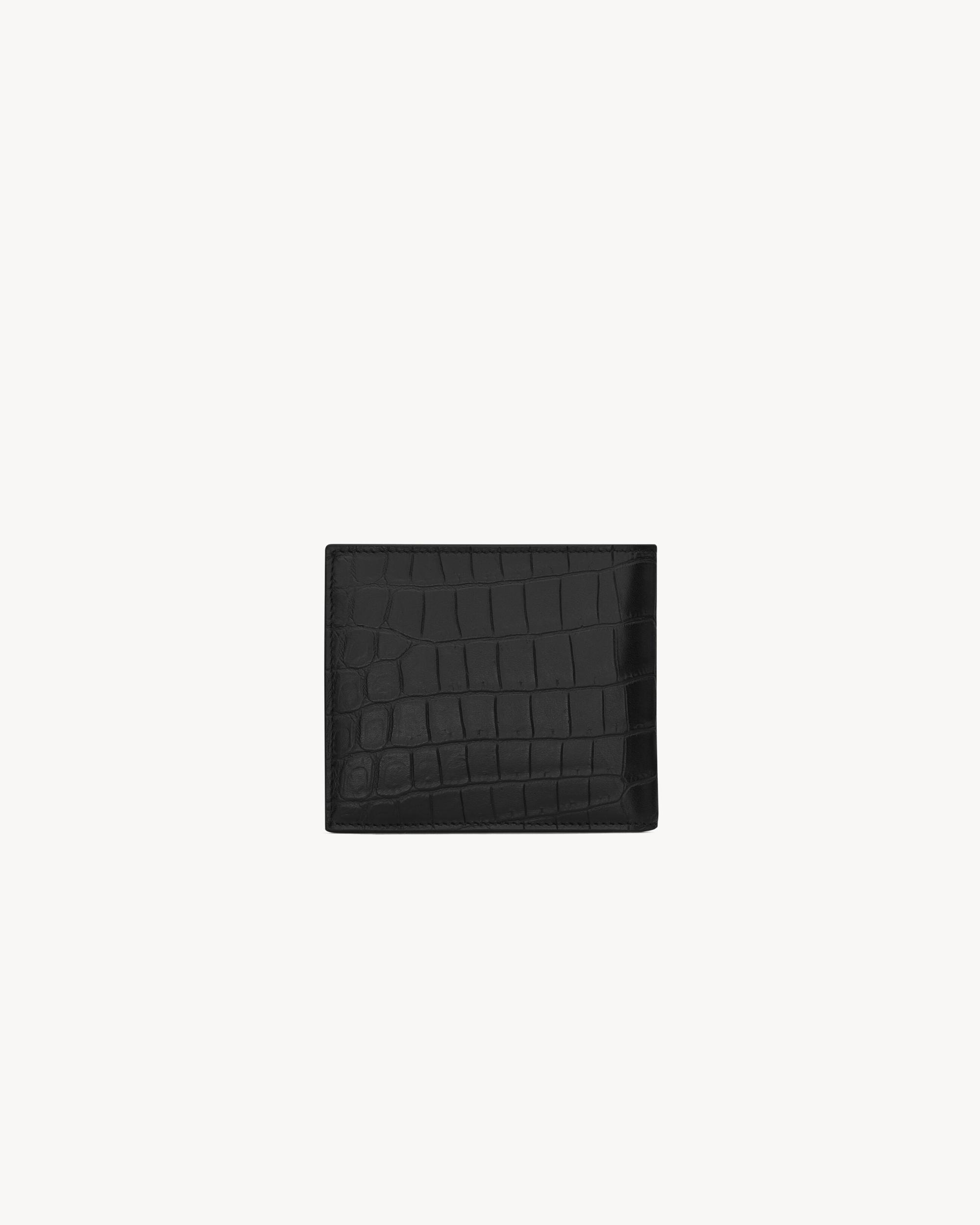 SAINT LAURENT PARIS East/West wallet with coin purse in CROCODILE-EMBOSSED leather Product Image