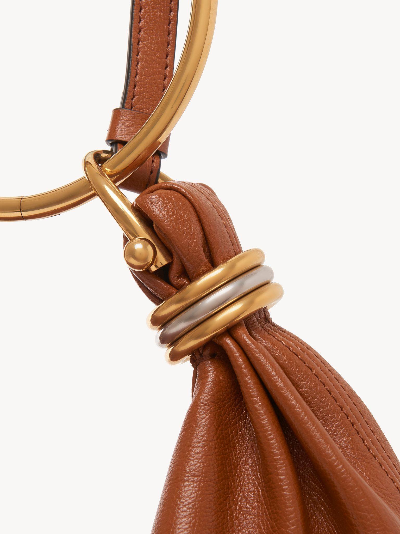 Small Bracelet hobo bag in grained leather Product Image